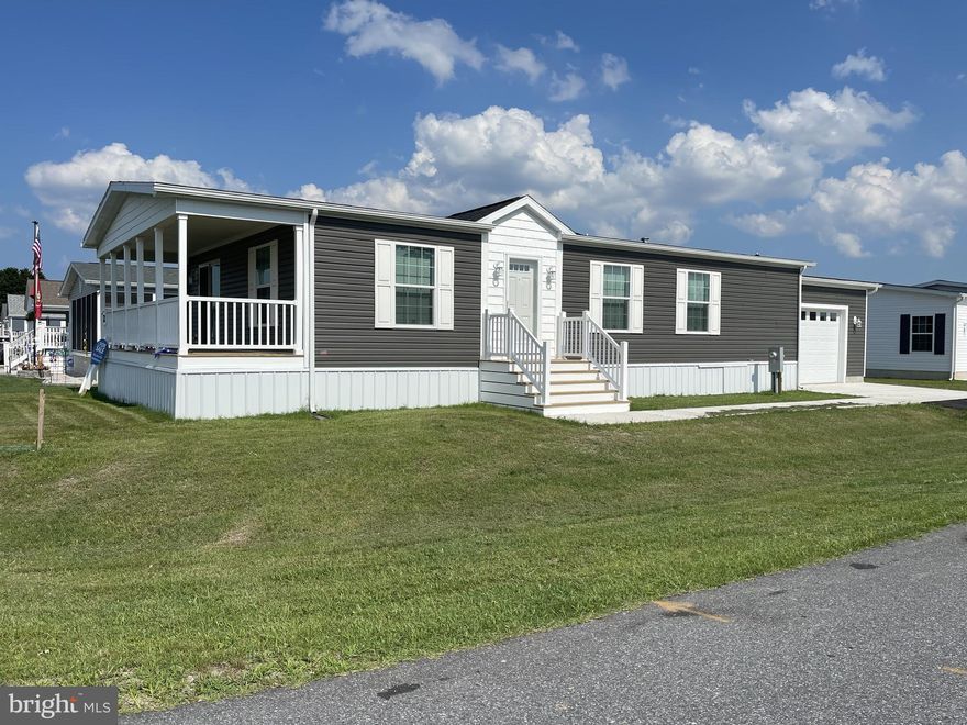 Beautiful Brand New 3BR Home in 55+ Sussex West. Contemporary style and built on energy efficiency and sustainability, our smarter beach homes focus on open floor plans, large windows, charming details and high-end finishes. Find luxury vinyl plank throughout, spacious living/dining/kitchen areas, gourmet kitchens with islands, walk-in pantries and beautiful stainless-steel appliances featuring natural gas cooking to keep the chef happy. Other features include pendant lights and recessed lighting, deep sinks, sparkling backsplashes, and generous primary bedrooms with huge walk-in closets and ensuite baths. Utilize the two additional guest rooms as your home gym, office or crafting space. Additional full bath and handy laundry/mud room complete the floor plan. These homes have a one car garage and off-street parking for two cars. Explore Sussex West, an active adult community with mature trees and amenities that include a beautiful clubhouse, heated indoor pool, dog park, pickle ball and shuffleboard (coming in 2025), bocce ball court and a horseshoe pit. Snow removal and recycling are included with your land lease, and you will enjoy community sponsored events and an onsite management team. Live a short drive to tax-free outlets, unique shops, world-class restaurants, and only five miles from the shops on Lewes’ Second Street. Perfect as your summer getaway or as your year-round residence, live your life in Sussex West, and live close to all that life in Delaware has to offer.

Our Land Lease Amenity Package Includes:
Clubhouse
Weekly Activities & Monthly Events
Indoor Salt-Water Swimming Pool w/Chair Lift & Shower Facility
Neighborhood Newsletter
Dog Park
Bocce Ball Court
Horseshoe Pit
Lewes to Georgetown Trail Access
Off Street Parking
Pets (2) Welcome
RV Storage (Fee)
Covered Mailboxes
Street Lights
Snow Removal
Clubhouse Rental
On-Site Management & Maintenance
On-site Sales Office with Home Listing Service
State-of-the-Art Security Camera System
Pickleball & Shuffleboard – Coming This Year