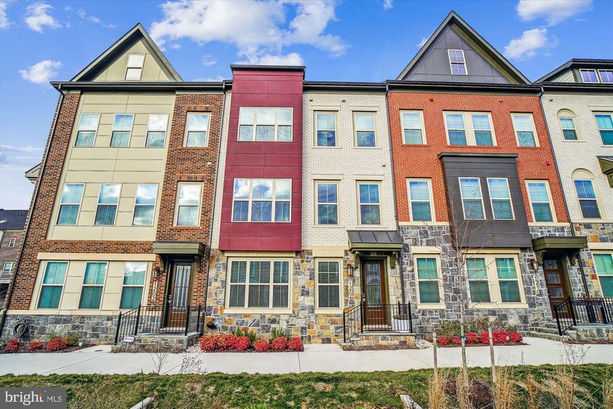 This expansive 4 finished level elevator townhome with 3 bedrooms, 3 en-suite full bathrooms, 2 powder rooms and a 2 car garage with EV charger is the epitome of comfortable luxury and offers all the space you need for family and entertaining needs as well as any desired private time. 

With all levels above ground, the welcoming entry invites you into the large family room with recessed lighting and tons of natural light plus a powder room and access to the garage.

The main level will take your breath away. With its open floor plan flooded with extraordinary sunlight , high ceilings, recessed lighting, multiple seating areas, gorgeous built-ins, plus access to the spacious rear deck, this floor will undoubtedly be the hub of happy gatherings.  The standout and striking kitchen boasts a large center island breakfast bar, stainless steel appliances, 5 burner gas cooktop with hood, double oven, and abundant bright white cabinetry with black pulls as well as gorgeous and plentiful countertops. The large dining room offers a built-in bar with shelving, cabinets and wine cooler.  From there, retire to the living room with a gas fireplace flanked by more coveted built-in shelving and cabinets and access to the spacious rear deck.  

Upstairs you’ll find 2 super primary suites, each with a stunning private bathroom. One suite enjoys a huge walk-in closet and an impressive bathroom with a double sink vanity and gorgeous shower, while the other suite  has a combination tub and shower plus plenty of closet space.

The 4th level of this incredible home, also accessible by the elevator, features the 3rd bedroom suite with large walk-in closet and private bath.  Feel free to take your pick of bedroom suites.  

Built by KB Homes, Downtown Crown has become a highly sought-after community that has much to offer including the modern clubhouse and pool, low HOA fees that include your lawn maintenance and the super close proximity to shopping, dining, entertainment and excellent commuter routes.

Luxury, comfort and convenience, it’s all right here.