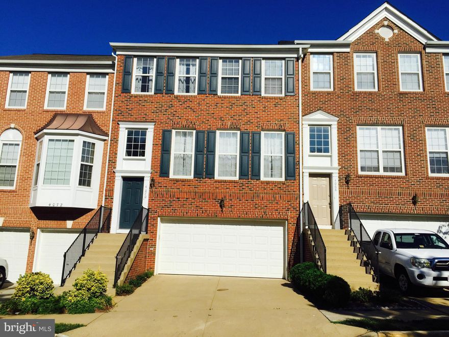 EXCELLENT LOCATION! Brick front 2 Car garage TH w/ 4bed/3.5bath. Close to Everything, 50/66/29 & Fairfax Co. Pkwy + All Shops in Fair Oaks mall. Bright and sunny all day & open floor plan, hardwood floors on main level, Large kitchen with ,granite counter top and SS appliances. Fully finished walkout basement with 4th bedroom and full bath. Fenced backyard w/well maintained patio.