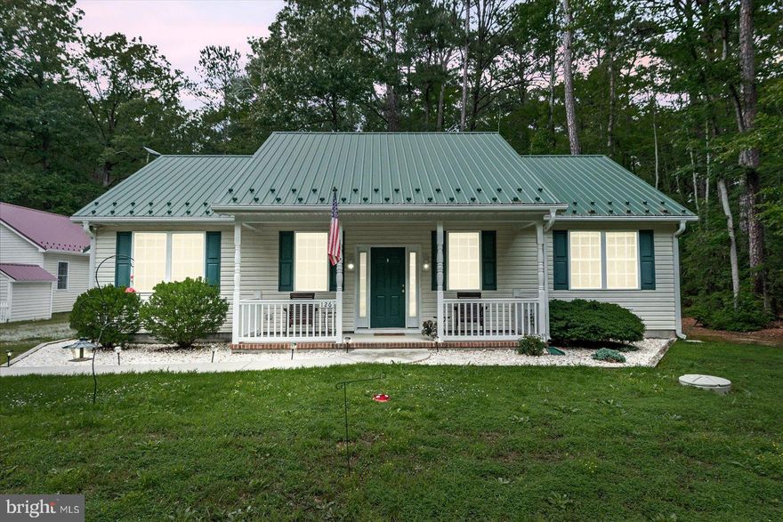 This amazing home is located in Ragged Point Beach. It is in great condition and is only 7 years old and recently painted. The green metal roof offers curb appeal and longevity and the garage roof matches. It  provides wonderful sounds when it rains. Home is equipped with leaf guard. 
The split bedroom layout provides privacy as well as making the center of the home the hub the home. 
The open kitchen, dining, and living floor is great for entertaining. Beautiful stainless steel appliances, soft close cabinets and the kitchen island make this area my sellers favorite part of the home.  
The primary bedroom if full of natural light , soft colors and a huge closet with ample shelving. 
The primary bath has a jetted tub, dual sinks and an amazing shower with a rain shower head. 
The opposite side of the home boasts two well sized  bedrooms filled with natural light and recently painted. Amazing front porch to relax on and view the wildlife from!
Level yard. Take a quick stroll down to the end of the road and you will see the beautiful water views . 
This community offers beach access!