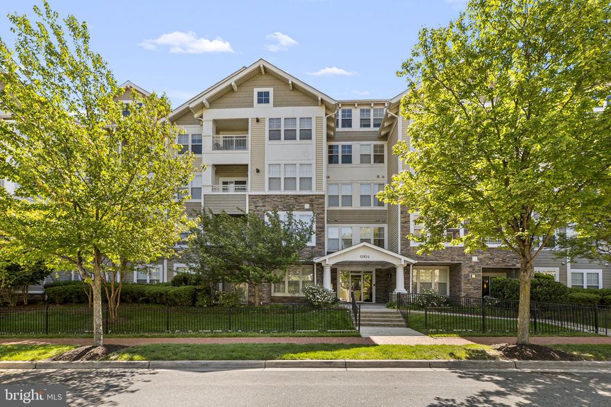 This charming 2-bedroom, 2-bathroom garden-style apartment offers a perfect blend of comfort and convenience. This home features an inviting open floor plan, ideal for both relaxation and entertaining. The spacious living area is enhanced by a cozy gas fireplace, creating a warm ambiance for gatherings. The eat-in Kitchen includes a built-in microwave, dishwasher, and gas range, along with ample table space for casual dining. Retreat to the primary suite, complete with a soaking tub and walk-in closet, ensuring a serene escape at the end of the day. Additional highlights include a convenient laundry area with stacked washer/dryer, a ceiling fan for added comfort, and elegant chair railings that add a touch of sophistication. Nestled in a vibrant community, residents enjoy access to fantastic amenities such as a clubhouse, outdoor pool, fitness center, and playgrounds. The neighborhood is surrounded by lush common grounds and walking paths, perfect for leisurely strolls or active lifestyles. Local parks and recreational facilities are just a stone's throw away, providing endless opportunities for outdoor fun. With easy access to major transportation routes, this home is not just a place to live, but a gateway to a fulfilling lifestyle. Experience the warmth and community spirit that makes this property truly special.