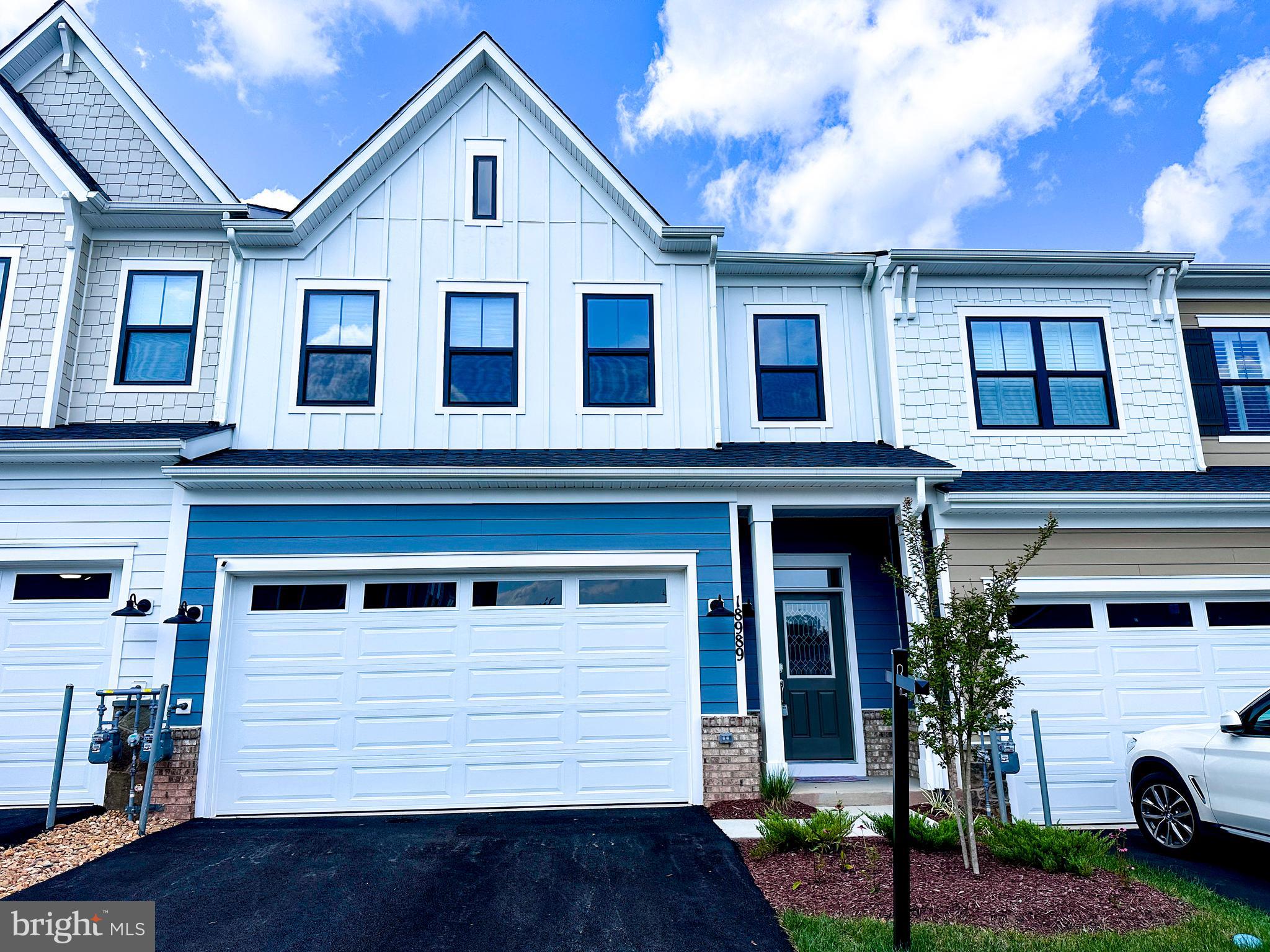 Welcome home! Step into this stunning 55+ villa with 3 bedrooms and 2.5 baths, nearly new - built in 2023. The Chappelle model at Cadence at Lansdowne offers over 2,600 square feet of luxurious living space across two levels. The main floor showcases an open layout with a chef’s kitchen featuring high-end appliances, upgraded quartz counters, and elegant shaker cabinets. The primary suite on the main floor is ideal for aging in place, with a bright, spacious bedroom, two closets (one walk-in), and a bathroom boasting a double vanity with quartz, a frameless glass shower with seating, and floor-to-ceiling tile accented by a listello design. Upstairs, discover a lofted living area, perfect for a second living space, two large bedrooms, a full bath, a media room, and a sun-drenched office. This home also comes equipped with modern tech, including a SONOS sound system, in-ceiling speakers, a Wi-Fi extender, security cameras, and a smart thermostat, all controllable via phone or wall unit. Cadence at Lansdowne offers a peaceful community set amidst a wooded landscape, complete with amenities like a dog park, pickleball and sports courts, a picnic pavilion, walking trails, and an amphitheater, all for a low HOA fee. Situated near Rt. 7, Lansdowne Town Center, Leesburg, One Loudoun, and the Ashburn Metro, you’ll have easy access to dining, shopping, and local vineyards. Nature lovers will also enjoy the nearby trails and the Potomac River. Don’t miss your chance, schedule a tour today!