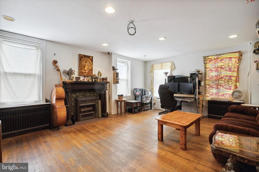 Incredible multi-unit building in stellar Fishtown location! **SELLER FINANCING AVAILABLE** This mixed-use property offers commercial space, which can be used as 1 or 2 units, a bi-level, 2br 1.5 bath apartment and 2 storage garages with a bonus shed. The front commercial space has a large main studio, a smaller rear room/bonus space, access to the basement for storage, half bath, wood flooring and glass block windows that offer privacy and great natural light. Perfect for a dance or yoga studio, office space, retail; the possibilities are endless. The rear commercial space offers 2 rooms and a half bath with its own private entrance. Each room features exposed brick and the front room has a large glass block window..  These space can be used together or separately as each have their own entrance from the street. The 2nd & 3rd floor are home to the 2br, 1.5bath apartment; a truly unique living space. The main floor of the apartment is home to an expansive living room with ample natural light, original wood floors, a faux fireplace and a wood accent wall. This room is equipped with hook-ups for a projector and speakers. The dining room boasts exposed brick, a unique wooden wall installation, a custom bar area, hardwood flooring and is equipped with hook-ups for 4 ceiling speakers in each corner and a projector in the center of the room. Also on this floor is the large custom kitchen featuring stainless steel appliances, a gas stove with an electric convection oven, built-in dishwasher and ample cabinetry; a home cooks dream. There is also a beautiful custom made island/table crafted from a local bowling alley’s lanes, perfect for entertaining or additional prep space. Off the kitchen is a small powder room perfect for everyday convenience and access to the roof deck; an amazing space. The 3rd floor is home to both bedrooms, each well sized, with large exposed built-in closets and wonderful natural light. The washer and dryer is situated in the hallway with a convenient shelf built in for storage. The full bath features a soaking jacuzzi tub with jets, a 3-headed shower with waterfall shower head, heated floor, built-in ceiling speakers and a motion sensored light over the toilet for complete comfort; a dreamy and relaxing space. The 2 garages are located to the rear of the property off of Cedar street. To access the bonus shed simply walk out of the kitchen and across the roof-deck. This space has built in shelving and a staircase that leads down to the garage as could be built out to use as a studio/bonus space or storage. AN IDEAL PROPERTY FOR AN OWNER OCCUPANT OR INVESTOR!! Located steps the Frankford Ave corridor and all Fishtown has to offer and with easy access to the 95, the Frankford-Market Line, & Aramingo Ave shopping this location has it all!