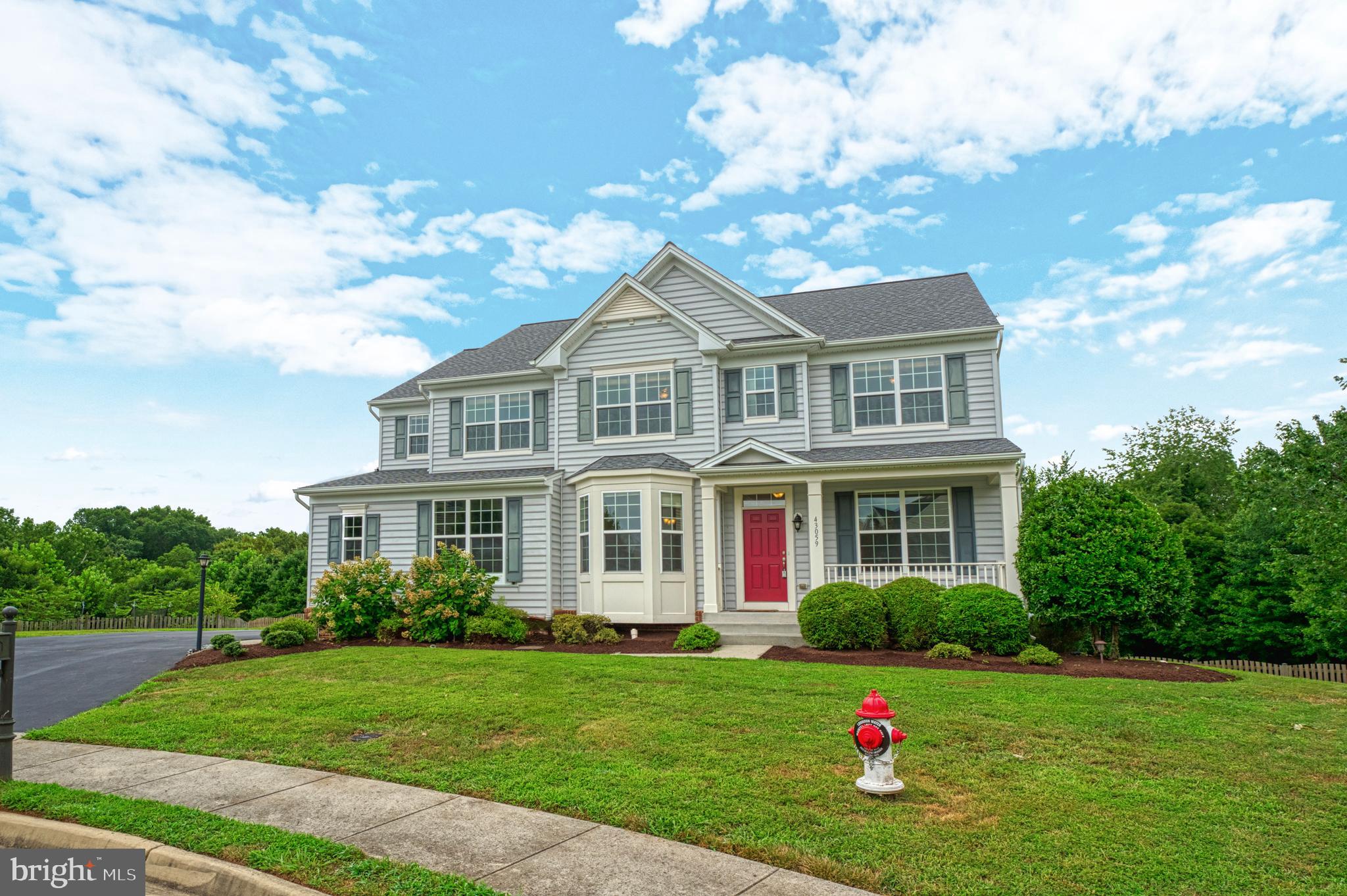 Beautiful, spacious home on a 0.63 acre fenced lot on a cul-de-sac backing to treed natural preserve area. This Kingston II model has bump-outs on all 3 levels with over 4,000 square feet of finished space. The main level is mainly bamboo flooring with an open flow with a dining room to the left, and a living room on the right upon entering the home from the front porch. There is a spacious office, half bath, family room with carpet, a breakfast area, and a gourmet kitchen. The kitchen has maple cabinets, granite counters, an island, and SS appliances. The family room has a beautiful stone fireplace. Off the kitchen walk out to the large custom deck with majestic views of the treed preserve area and the mountains in the distance with stairs to a concrete patio below. Upstairs there are 4 generous bedrooms with 3 full bathrooms. with LVP flooring. The primary suite is spacious with a sitting area along with a soaking tub, shower, water closet, and dual vanities. Second bedroom with ensuite, 2 additional bedrooms with a hall bath, and the laundry room completes the upper level. The lower level has LVP throughout with a large rec room walking out to the concrete patio into the spacious yard, a 5th bedroom, full bathroom, and spacious storage room. The location provides easy access to Rt 15 heading north towards Frederick County, MD or south towards historic downtown Leesburg. Convenient to many wineries, breweries, cideries, hiking, outdoor activities, shopping, and restaurants. Don't miss out on this wonderful home!