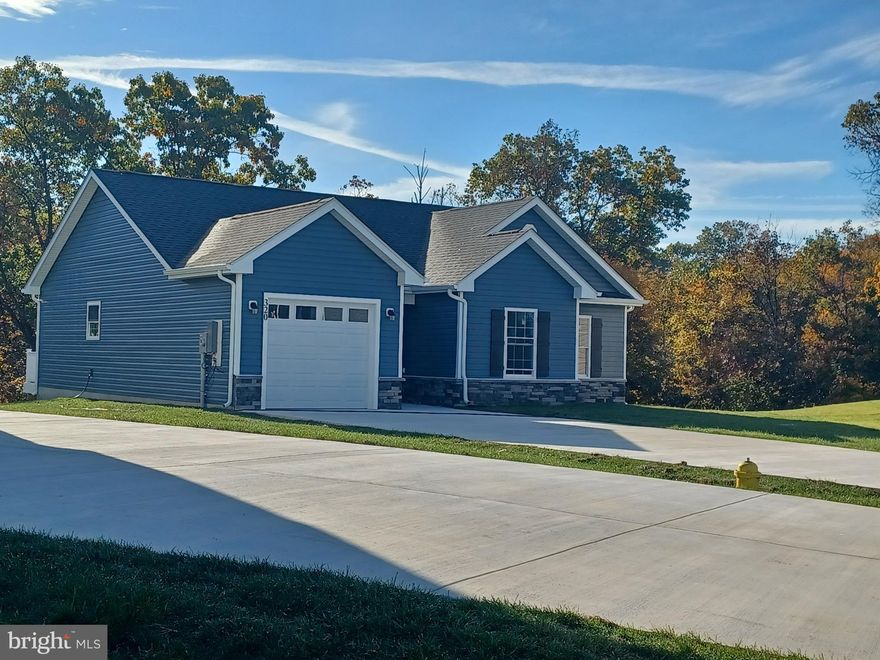 Perfectly Cute Bungalow for a Retiree or Small Family!   This ranch features open concept with vaulted ceilings, Luxury vinyl plank flooring, stainless appliances, granite counters and a breakfast bar in kitchen and open to the great room, perfect for entertaining.  Tiled bath for the two guest bedrooms.  Primary bedroom with tray ceiling, recessed lighting & fan.  Also features, huge walk in closet and a bath featuring oversized tiled shower with glass door.   10 X 12 deck. Concrete drive and walk way leads to the covered entry and 1 car garage.  The garage is insulated with insulated garage door and openers.  Buyers can select all interior and exterior finishes if you hurry.  As with all new construction, Purchaser pays transfer taxes.  Some photos may reflect options.