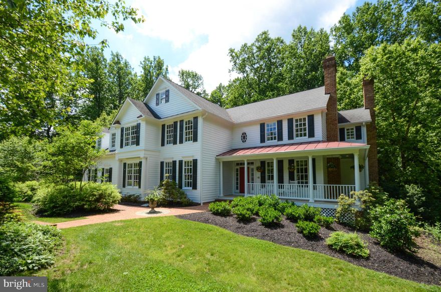 Enjoy cocktails on the covered porch of this country style traditional home, abounding w/ character from the reclaimed heart pine floors through the detailed millwork. Gourmet kitchen update w/in last 5 years of professional appliances and granite counters. Second level features 5 bedrooms, Master Sitting Room w/ gas fp, and luxury Master Bath. Extensively finished walkout lower level w/ BR #6.