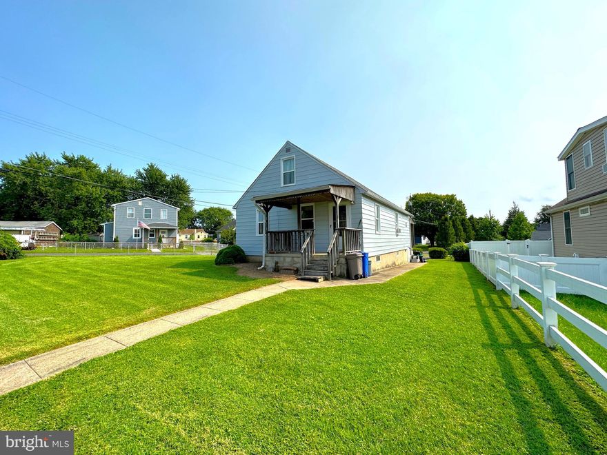 THIS HOME QUALIFIES FOR 100% FINANCING FOR A QUALIFIED BUYER!
NEW PRICE - GREAT OPPORTUNITY! Welcome to this Rosewald Beach home located on a large, fenced corner lot.  Enter the home to an expanded living room with ceiling fans. Hardwood floors under the carpet.  Full bath on the main with new walk-in shower. Potential for one or two additional bedrooms on the main.   The kitchen opens onto the spacious dining room, perfect for large family gatherings.  Laundry room on the main with extra storage space. Two bedrooms on the upper level. Relax on your front porch or the back deck that overlooks the open backyard ready for a beautiful garden.  The fenced gate opens to a parking pad with space for a future garage. Plenty of storage in the basement.   Walk to the community pool & neighborhood playground.   Home is within walking distance to schools, shopping, & restaurants.  This home has great potential.  Stop by and call it home today!  Estate sale sold AS-IS. Excluded Parties