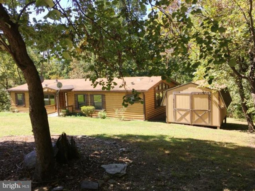 Awesome log cabin siding adds appeal along with a wonderful lot that backs to the woods. Hidden screened porch and hide - away room with huge windows to enjoy peaceful living. Spacious great room includes warm wood fireplace to get your through the cold weather. Come see your hideaway in the hills of Harpers Ferry, WV a beautiful area of rivers and mountains.