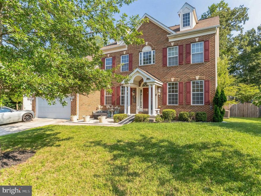 $24,000 PRICE REDUCTION! SPACIOUS BRICK-FRONT 4 BEDROOM/2.5 BATH 3-LEVEL COLONIAL with 2-CAR GARAGE - ON NO-THRU STREET. 2-story entry foyer. Most of the main level has hardwood floors. Bonus Room/Office, Gas fireplace in Family Room. Kitchen has island and gas cooktop. Upper level features a Primary Bedroom with Sitting Room, Walk-in Closet and Private Bathroom with a jetted soaking tub, separate shower stall, and double-sink vanity. Unfinished lower level offers lots of options for rooms and storage and has rear exit to fully-fenced backyard. Less than 3 miles to front gate of Joint Base Andrews.