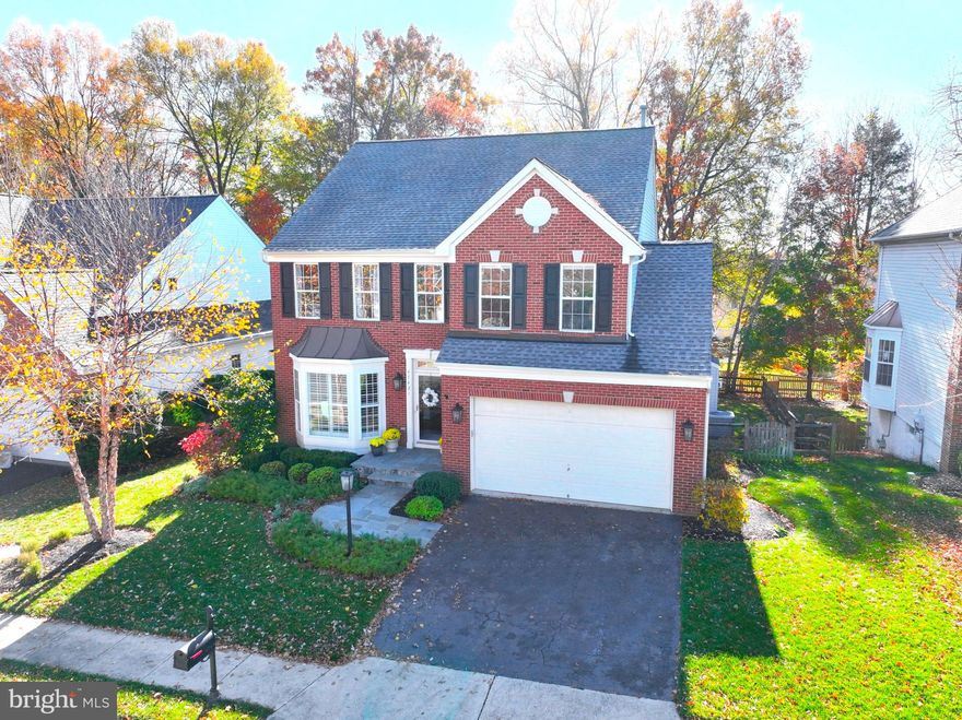 This stunning colonial home in the desirable River Crest community offers a perfect blend of comfort and style. With 4 spacious bedrooms and 3.5 baths, the interior features a traditional floor plan that includes a cozy gas fireplace, an upgraded kitchen with granite countertops, Stainless Steel appliances and a bright breakfast area. The fully finished basement with a walkout entrance provides additional living space, ideal for gatherings or relaxation. Step outside to enjoy the beautifully landscaped yard that backs to serene trees, creating a peaceful retreat. Located conveniently near commuter lots and just a short drive to the airport, this home is also close to excellent schools and parks, enhancing the community experience.  With an attached garage and ample parking, this property is a true gem in a vibrant neighborhood.  Rivercrest is a gorgeous community with tree lined streets, walking trails, tot lots, terrific schools, and community swimming pool with a swim team. There is also access to the Potomac River and year round community events, such as a 4th of July Parade, Halloween Parade, Easter Egg Hunt and More! It's time to make your move!   Embrace the lifestyle you've been dreaming of!  Walk through this home right now by clicking the Tour button to access the 3D Matterport tour!  Open Sunday from 1 to 4 pm.  See you there!