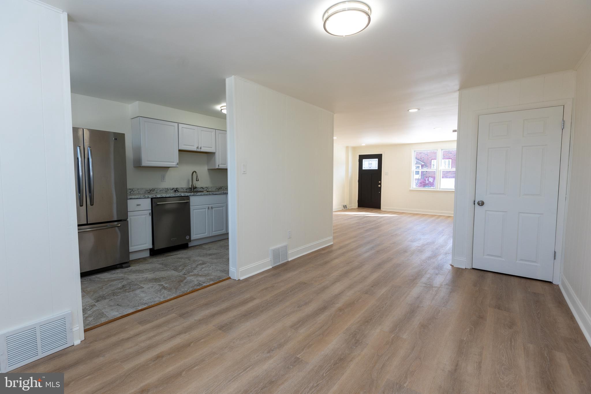 Move-in ready!! Newly renovated!! Brand new kitchen with stainless steel appliances. Brand new laminate and carpet flooring throughout. New tile in kitchen and bathroom. Finished basement with laundry hookups, and extra storage space. Driveway parking in the back. Rear storage area could be made into a garage. Low tax neighborhood. Schedule your showings! Agent has financial interest.