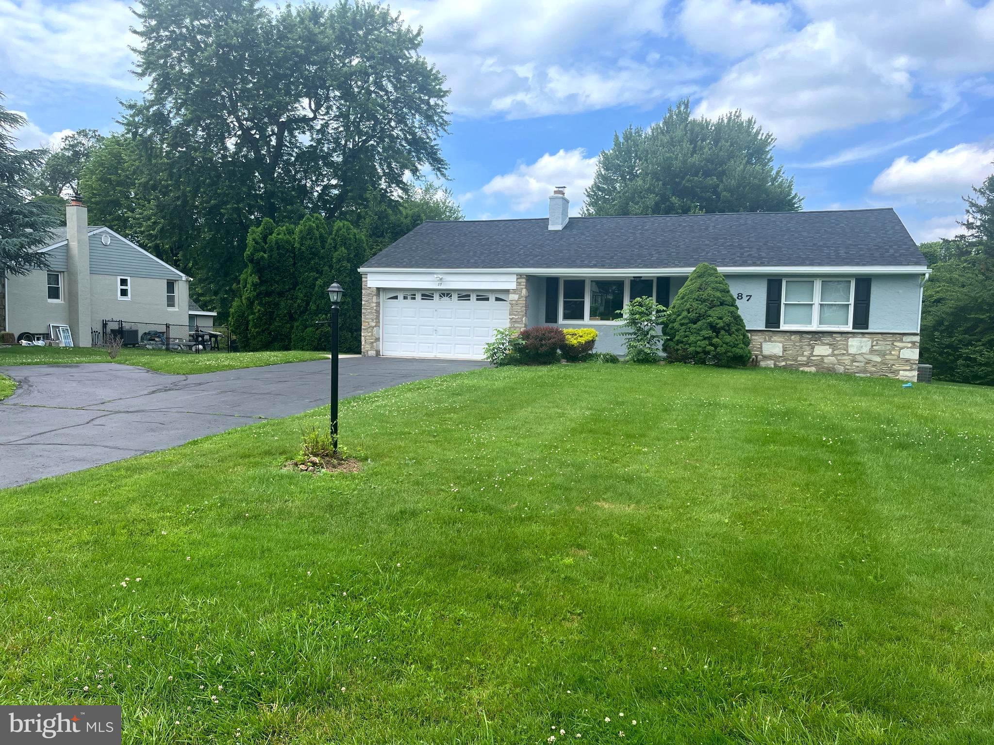 Beautifully remodeled 3 bed 2.5 bath rancher available NOW in Northampton! Walk into the bright living room with a cozy stone fireplace. Also on the main level are 3 nicely sized bedrooms and a full hallway bathroom - complete with a beautiful marble deco and tile shower. The Main bedroom features its own full bathroom with similar modern finishes. Moving away from the bedrooms, you will find the kitchen featuring shaker style cabinets, granite countertops, and stainless steel appliances. From the kitchen, you can access the large deck from sliding doors to a beautiful open backyard posing endless opportunities - from entertaining to soaking in the sun on warm summer days. Also accessible from the kitchen is an attached one car garage and full basement. This partially finished basement includes a convenient separated laundry room, and a large rec room with a built-in bar and powder room! Making this the perfect spot to entertain, or to make your own relaxing escape separated from the main level. Extra space includes storage room and workshop area. Basement draining system in place. Additional features from the remodel include "life-proof" flooring throughout the living room and kitchen, tile floor in bathrooms, and new carpet installed in the bedrooms. Recessed lighting and fresh neutral paint throughout. House was demo'd to the block, then rebuilt with new exterior walls and insulation. Totally remodeled with new floor plan to make room for master bathroom - new kitchen, new bathrooms, new water heater - almost like new construction on the inside!! New Roof too! Don't miss out!! Owner is a PA licensed real estate agent. *** Seller has been made aware through feedback that basement dampness needed to be addressed. Although previous owner installed a waterproofing system with 3 sump pumps, front wall was never addressed. Although previous owner installed a waterproofing system with 3 sump pumps, front wall was never addressed. Jamison Waterproofing provided a solution and the work outlined in the estimate attached to this listing was completed on Monday 7/14/25 - with guarantee!