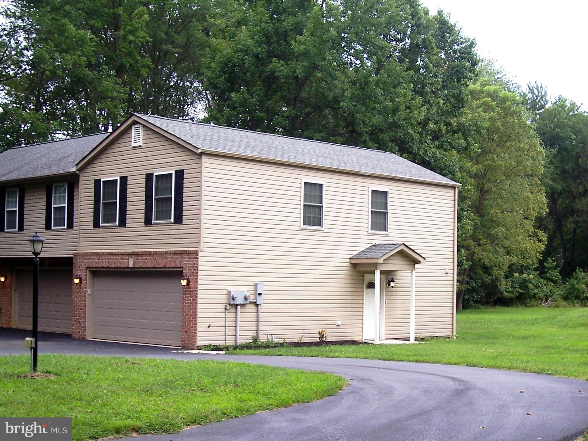 Upscale apartment 1BR, 1FB, kitchen w/granite counters and stainless steel appliances, sep laundry rm, living rm area and dining area above oversized 2 car garage. Garage lvl also has half bath. Immediate occupancy. $30/mo flat water fee, $45/mo grounds maint fee. Pets case-by-case. Near new St. Charles HS & stadium. Home on private setting.