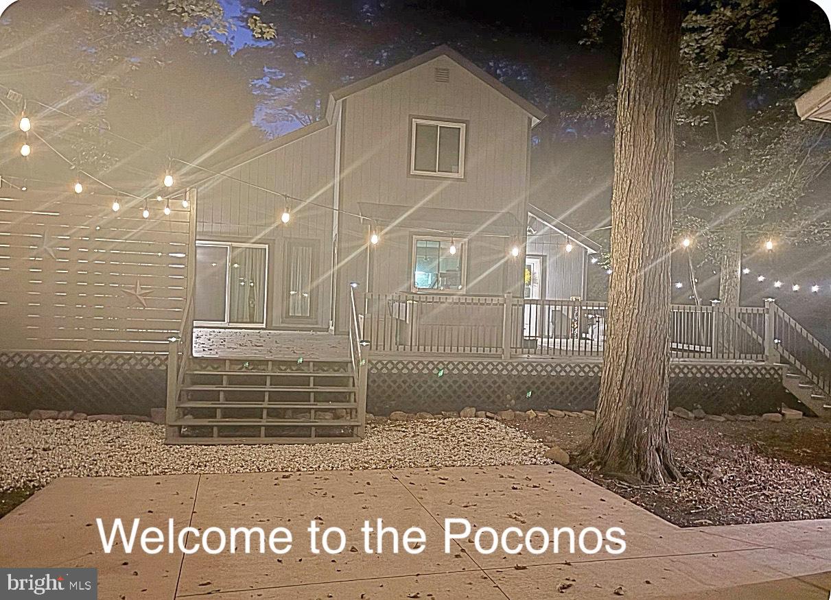 Welcome to your perfect Pocono retreat! This beautifully maintained 3-bedroom, 2-bath contemporary home sits on over half an acre, offering peace, privacy, and plenty of space to relax or entertain. Inside, you'll find a bright and open layout featuring a newly updated full bath, brand new flooring, and a stylish modern aesthetic throughout. Step outside to the absolutely gorgeous deck, complete with a hot tub—ideal for soaking under the stars. A large garage provides plenty of room for vehicles, storage, or even a workshop. Whether you're looking for a full-time residence, weekend escape, or investment property, this move-in ready gem is a must-see in the heart of the Poconos.