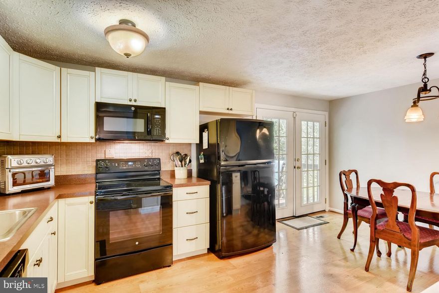 FANTASTIC NEW PRICE! Welcome home! This home had been lovingly cared for and updated, including: Remodeled Kitchen (2005) with country cabinets, backsplash, new floor, and new appliances (2018). Replaced windows (2008), updated bathrooms (2006) and new shower (2014), HVAC (2017), Siding (2018), Roof (2010), replumbed main service plumbing to the house (2016). The exterior has a two-level deck perfect for entertaining. Lower Level has a bedroom, bath, laundry and family room. The main level has a living room, a large eat-in gourmet kitchen, two spacious bedrooms, and a full bath. Convenient to shopping and major commuter routes. Sellers are motivated with this price-priced below market value. Do not miss out on this beauty!