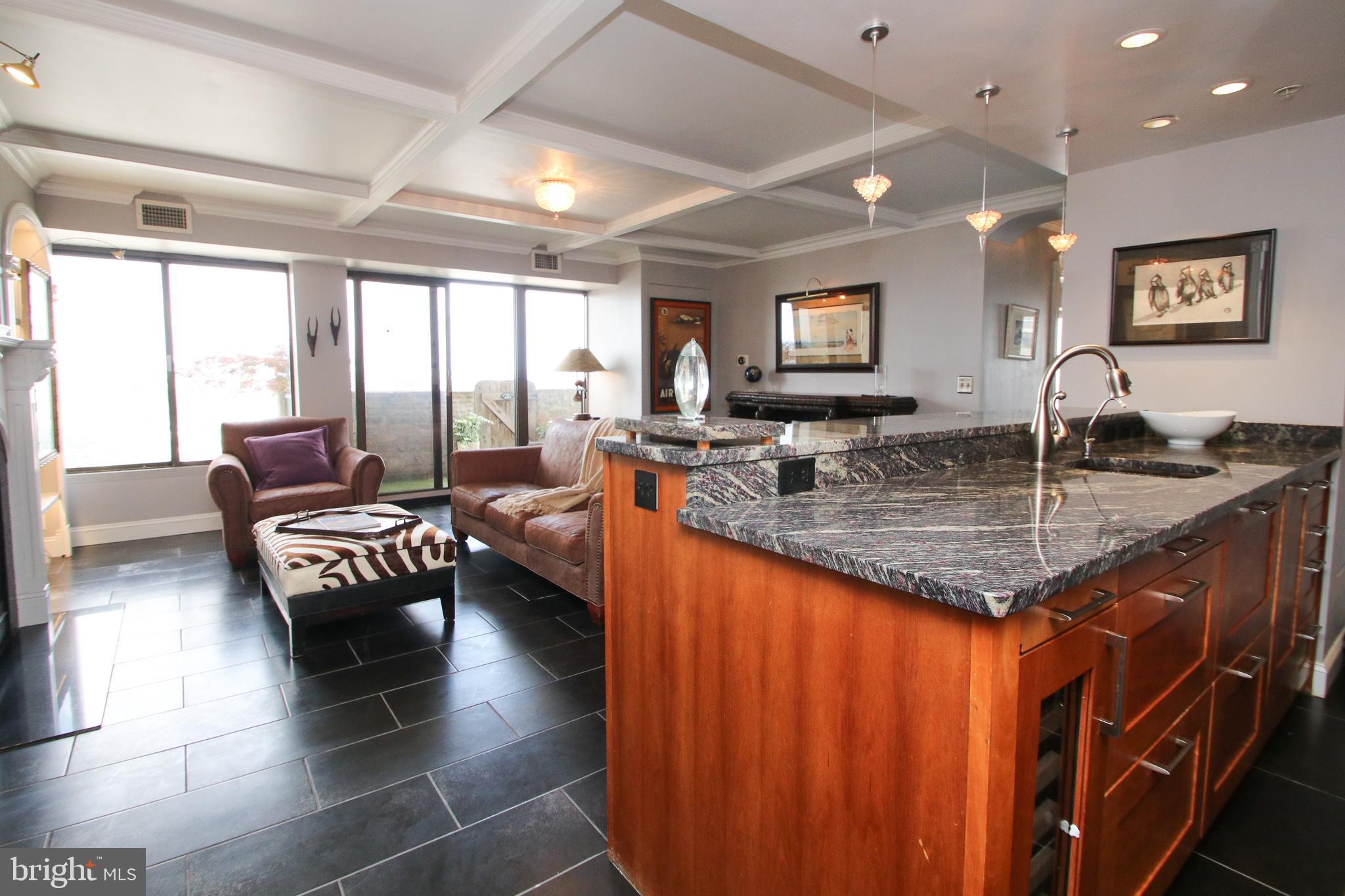 This corner unit is as unique as they come. This beautiful condo has been completely gutted and updated just few years ago. It come with covered deeded PARKING, BALCONY, in unit WASHER AND DRYER, oversize windows for maximum light and endless views. This particular unit features open layout living/dining space with custom kitchen cabinetry, Geganeau oven and cook top, sub zero fridge, Wine fridge, recess lightning, eat-in granite island, custom molding ceiling, gas fire place, tile flooring, custom balcony with water hose to water your plants, Nest thermostat, built in bookshelves and so much more. Both bedrooms are large and feature wall to wall windows, custom closets and recess lighting. The bathroom features a fully tiled stand up shower, heated steam free mirror, and a closet for storage. City View condominium is located in one of the most highly sought after neighborhoods in our City. From the well-manicured grounds to the 24-hour front desk, you will always feel welcomed when you come home. It features an Outdoor heated Swimming Pool, Newly Renovated modern lobby with front desk and security team, restful spots to read in the open air of the new garden, Fitness Center, lending library, business center, yoga studio, on-site management and much more.