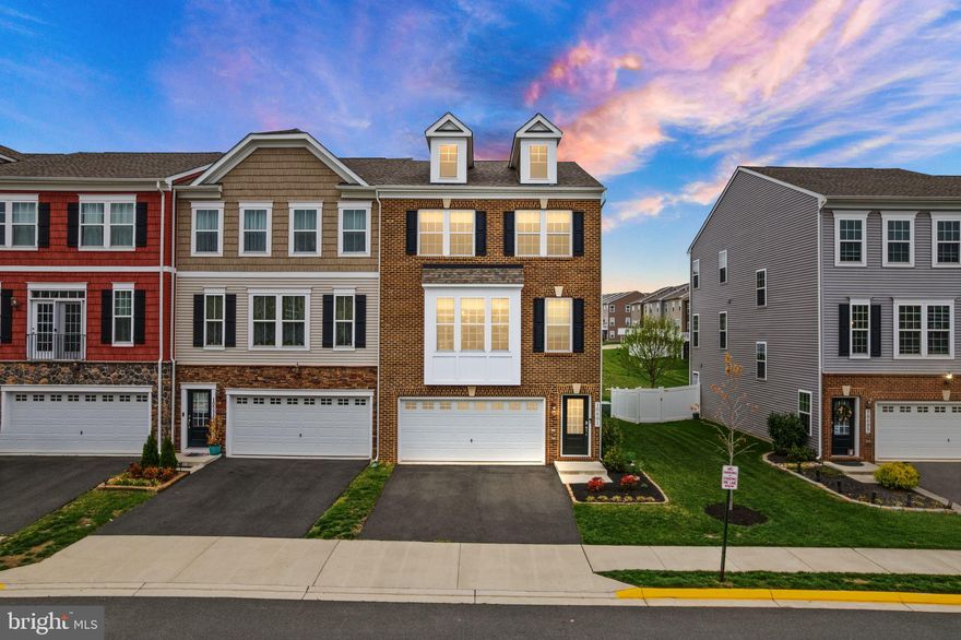 Welcome to this beautifully appointed 3-bedroom, 3.5-bath end-unit townhome offering space, style, and comfort in every corner. Located in the desirable Bradley Square community, this home boasts over three levels of thoughtfully designed living space.
Step into the heart of the home—a gourmet kitchen that’s sure to impress with stainless steel appliances, dual ovens, a large island, and elegant finishes throughout. The open floor plan flows effortlessly to the spacious living and dining areas, ideal for both entertaining and everyday living. Step outside to enjoy a large deck, perfect for morning coffee or summer gatherings.
Retreat upstairs to the luxurious primary suite featuring a walk-in closet, an additional closet, and a spa-like ensuite bath with modern finishes and a tranquil ambiance. Two additional bedrooms, a full bathroom, and a conveniently located laundry area complete the upper level.
The walk-out lower level provides a versatile recreation room, a full bath, and direct access to the 2-car garage, making this space ideal for guests, a home office, or movie nights.
Convenient location close to Old Town Manassas, commuter routes, dining and shopping!  Community amenities for residents to enjoy are a splash park, playgrounds, and common areas!