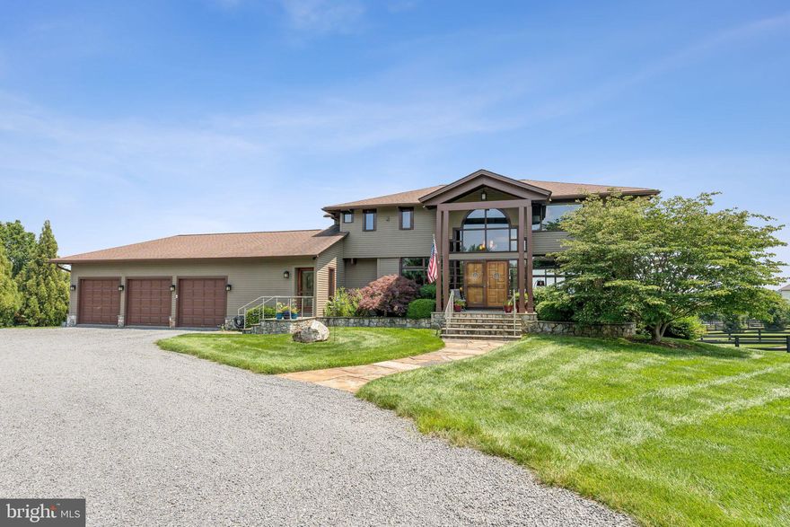 **Entertainers Paradise!!**This horse lovers paradise is nestled within Rosemont Farm, an exclusive equestrian community of just 22 homes outside of historic Waterford, Virginia, this spectacular property has use of 120+ acres of common area riding and walking trails. 
At the heart of this magnificent property is a stunning cedar Acorn Deck Home situated on 6.65 acres of lush, pastoral land with mature landscaping. Known for their casual elegance and exceptional construction, Acorn Deck Homes are individual works of architectural artistry, designed to seamlessly blend indoor and outdoor living.
The journey into this extraordinary home begins at the spectacular two-story foyer. This striking entrance sets the tone for what is to come—a thoughtful blend of rustic charm and contemporary refinement. 
The gorgeous eat-in kitchen is a masterpiece of modern luxury. It features top-of-the-line stainless steel appliances. The copper farm sink adds a touch of rustic charm, while the stone countertops exude durability and elegance. A chef's island is flanked by furniture-quality cabinets that provide ample storage. 
Off the kitchen is the two-story family room. The space is defined by a wall of assorted windows, which frame stunning vistas of the outdoors. The natural beauty is complemented by a hand-cut stone fireplace that stretches to the vaulted ceiling. Adjacent to the family room, a new Trex deck spans the back of the home. A perfect setting for sipping coffee at sunrise.
The main level boasts a private home office outfitted with full glass pocket doors, providing a quiet retreat for work or study. A versatile home gym offers the option to convert into a main-floor bedroom for added flexibility. The walk-in pantry and large laundry room contribute practical convenience, while a rustic-chic half bath and side hall lead to an enormous three-car garage, leaving no detail overlooked.
The upper level features the stunning owner’s suite and two additional large bedrooms, each with vaulted ceilings and panoramic views. 
The lower level of the home boasts a wall of windows ensures full daylight, making the space feel bright and open and features a guest room with full bath as well as a second home office space.
Just outside is the massive brand new patio surrounding the gorgeous heated salt water pool and hot tub.  The patio has multiple seating areas and even a stone barbeque station.
The brilliantly designed barn complex elevates this property to equestrian perfection. A dedicated driveway leads to the sophisticated yet functional 36 x 48 barn, which is open, airy, and well-lit with the security of lightning protection. The barn features five 12 x 12 box stalls equipped with rubber mats for comfort. Three stalls include Nelson Automatic Waterers, while four boast the “patio feature,” adding an extra layer of luxury. Additional amenities include a hay loft offering ample storage space, a grooming stall and wash stall, a heated and air-conditioned tack/feed room complete with a sink, granite counters, custom cabinets, and a refrigerator. Every feature of this barn was meticulously considered in the design phase, including the blue stone skirt that enhances drainage and prevents mud accumulation. The elevated site ensures that the barn remains functional year-round.
The fields are bordered by well-maintained 4-board fencing that ensures safety and charm. If horses aren’t your passion, the rolling pastures would make an exceptional vineyard. (Waterford is the home of the "Virginia Vineyards Association").
A 30 x 12 run-in shed with electricity and access to a fourth automatic waterer keeps horses comfortable. Additionally, covered storage for farm implements ensures that equipment remains organized and protected.
The entire property benefits from a whole-house generator, which guarantees consistent water and electricity supply for both the barn and the house, reflecting thoughtful planning and attention to detail.