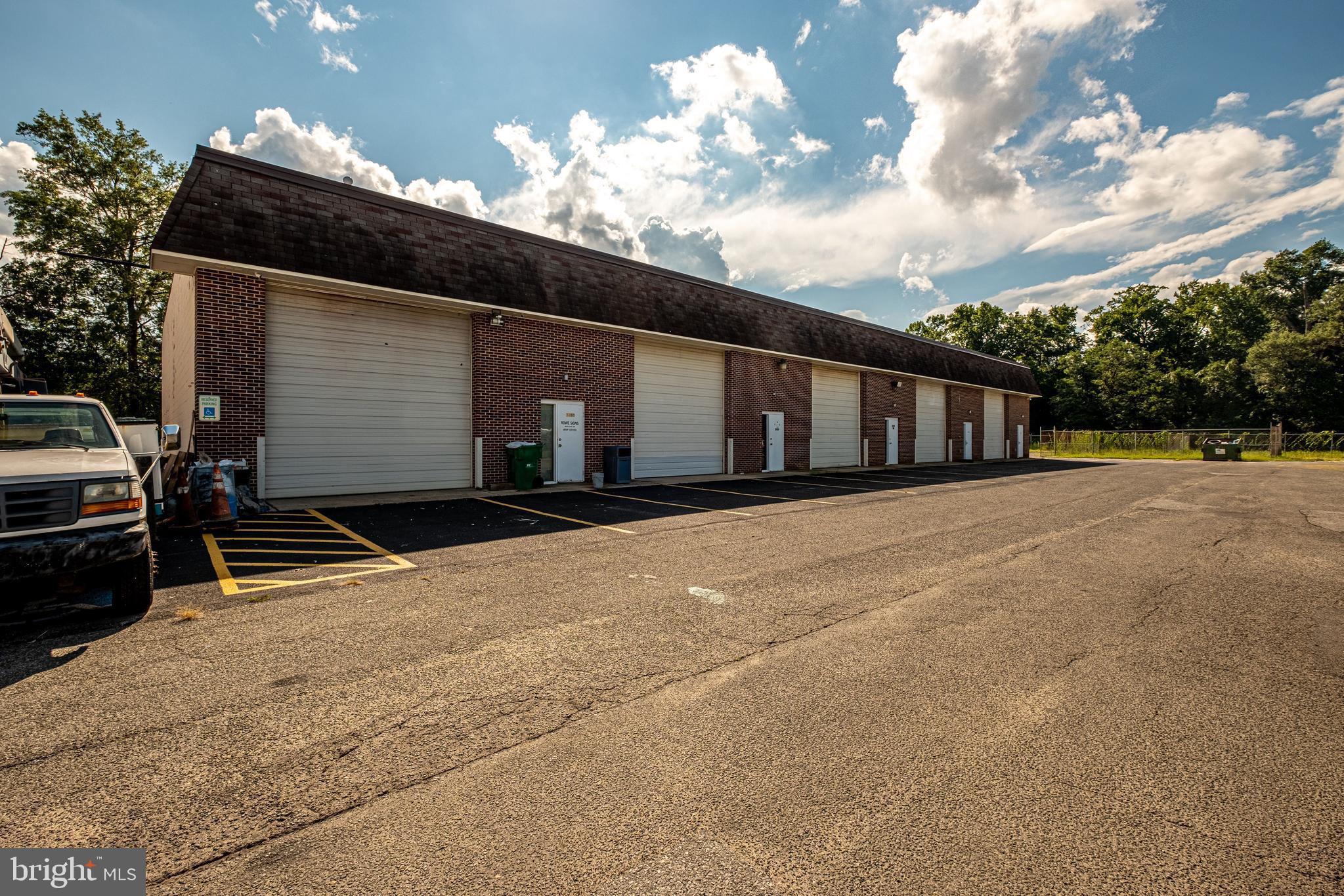 2,100 SF +/- Open Warehouse Within Gough Industrial Park. Floor Plan Includes Open Warehouse w/ One (1) Bathroom. Oil Heat, No Air Conditioning. 14 FT Drive-In Overhead Doors. 19' 6" CLEAR Ceiling Height. Tenant responsible for separately metered utilities & annual $400.00 parking fee. NO AUTOMOTIVE USES (Per Owner Due to Exclusivity Clause w/ Existing Tenant).
Fenced Yard Space Available for Additional Cost Upon Request.