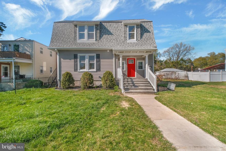 Welcome to this beautifully renovated Dutch Colonial, where classic charm meets modern upgrades throughout! Step inside to an open and inviting floor plan featuring durable LVP flooring that flows seamlessly throughout the first floor. The bright and airy living room is perfect for entertaining, while the adjoining dining area creates an ideal space to host and enjoy meals with family and friends. The spacious kitchen is a true centerpiece, offering abundant cabinetry, generous prep space, quartz countertops, a stylish tile backsplash, and a large island, perfect for quick bites or gathering with guests. The main level also features a sun-filled ensuite bedroom with a full bathroom complete with a custom tile walk-in shower, ideal for guests or convenient one-level living. Upstairs, retreat to the expansive primary suite boasting ample closet space and a luxurious ensuite bath with dual vanities, a soaking tub, and a beautifully tiled walk-in shower. Two additional bedrooms, a full hall bath with a tub/shower combo, and a conveniently located laundry area complete the upper level. The finished lower level offers flexible space for a rec room, additional living area, or home gym, along with extra storage. Outside, enjoy the backyard, perfect for hosting summer BBQs, and the convenience of a rear driveway for easy parking. Ideally located near Northern Parkway, Liberty Heights Avenue, I-83, and I-695, this home offers both comfort and accessibility. A true move-in ready gem!