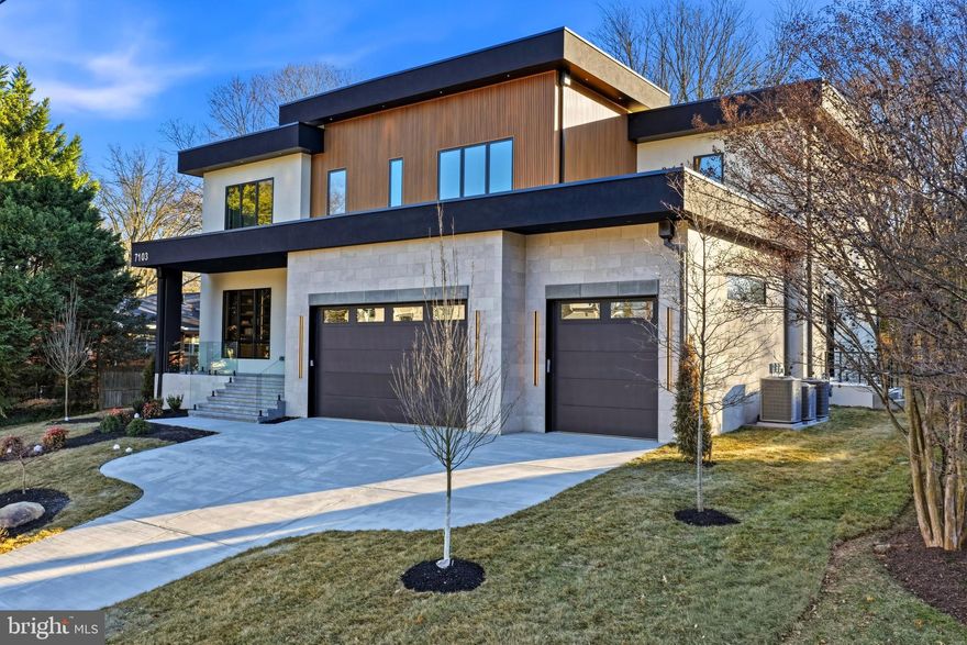 Open House Saturday and Sunday 1 to 4:00pm! Hello, future homeowner. I’ve been waiting for you. My name? I don’t need one. But you’ll call me Home soon enough.

Crafted to stand apart and built with intention, I’m a contemporary statement of design and precision, spanning over 8,000 square feet across three thoughtfully curated levels—each connected by a future-ready elevator shaft, so every floor feels like the main event.

Your arrival sets the tone. A striking 10’ x 5’ aluminum pivot entry door with sidelights and an integrated camera opens to 11-foot ceilings, wide-plank engineered white oak floors, and expansive Pella casement windows. Architectural wall paneling, custom 8’ interior doors, pocket doors, and a floating staircase with glass railings and illuminated steps reinforce that nothing here was accidental. Lighting is equally intentional, featuring ASD trimless 4” recessed LEDs on the main and lower levels, paired with LUXRITE recessed and flush-mount LEDs in closets and select spaces throughout.

I offer 6 bedrooms, 6 full baths, and 3 half baths, designed for comfort and flexibility. A private main-level suite includes its own exterior entrance, backyard access, Porcelanosa tile finishes, and a spa-style bath with a Delta Velum Monitor 14 Series pressure-balanced shower system in Brilliance stainless—perfect for guests or multigenerational living.

Now to the heart of it all. My main gourmet kitchen is a showpiece, featuring custom European cabinetry with smoked glass accents, quartz countertops, a full-height backsplash, dual sinks, and a premium Miele appliance suite with PITT cooktop, Thermador refrigerator, built-in coffee maker, oven/microwave combo, multiple dishwashers, and pot filler. Fixtures include Signature Hardware faucets and pot filler. Just beyond, a secondary catering kitchen—equipped with GE Café appliances, a Kraus Oletto faucet, KIBI circular pot filler, and direct patio access—keeps entertaining seamless.

In my dramatic two-story family room, a porcelain tile fireplace anchors the space, while a Bonelli multi-sliding, multi-stacking 3XO glass door opens fully to the outdoors. Built-in audio throughout the home ensures every moment has the right soundtrack.

Upstairs, the primary suite rivals a luxury retreat, complete with a private balcony, porcelain tile fireplace, integrated speakers, and a morning wet bar. The spa-inspired bath features heated floors, dual vanities with makeup station, a freestanding soaking tub, and a thermostatic 15-spray ceiling-mounted shower system with handheld. The boutique dressing room impresses with a custom European closet system, glass doors, LED lighting, jewelry inserts, 42 drawers, a center island, and designer chandelier.

The lower level is where I truly unwind. With 10-foot ceilings, fully tiled recreation spaces, European cabinetry, a Kraus Oletto industrial faucet, Calacatta Zeus Black Cosmic Dekton countertops, XO tall refrigerator, wine display, media room, glass-enclosed gym, and custom cedar dry sauna, this level was built for nights in that feel like nights out. A bedroom, full bath, additional powder room, and walk-up side entrance complete the experience.

Behind the scenes, I deliver just as much: three-zone Carrier HVAC, gas and tankless water heaters, spray-foam insulation, dual sump pumps with radon mitigation, and a three-car garage with epoxy floors.

Outside, enjoy a flat, private backyard and covered rear patio finished in natural stone, with automatic retractable screens.

Tucked on a quiet cul-de-sac just moments from Downtown McLean and McLean High School, I offer the rare balance of privacy and proximity.

I’m not just a house.
I’m your next chapter—designed with intention, built with precision, and ready to welcome you home.