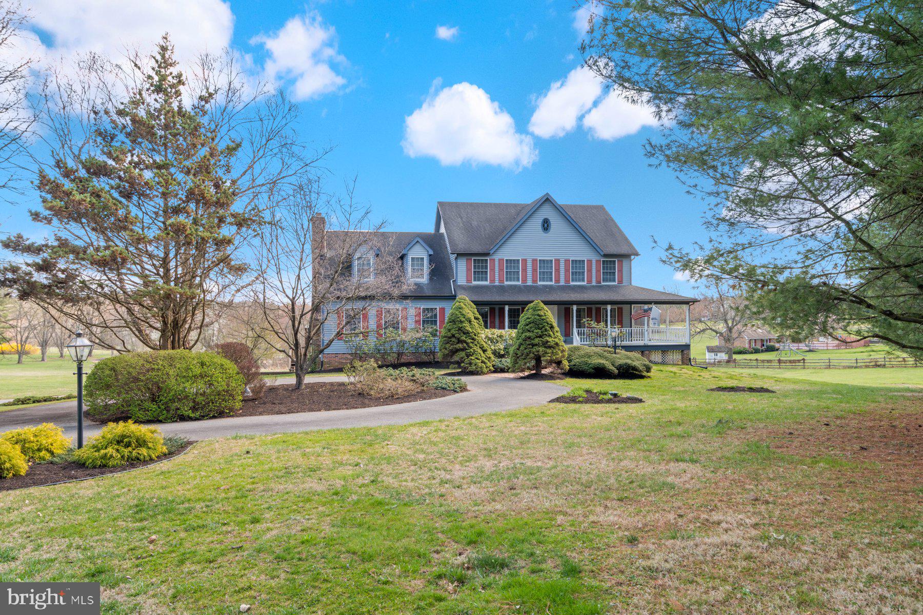 Incredible Opportunity to own a home in Ken Mar Manor - with beautiful views of Piney Run Park & the Carroll County Countryside!! Nestled on a sprawling 4.24-acre lot, this colonial-style gem epitomizes serene living with approximately 3,748 square feet of above grade living space. A charming wrap-around porch welcomes you, leading to a side screened porch - ideal for enjoying the tranquil surroundings. The main level boasts a welcoming foyer, a versatile office space, a full bath, a spacious living room, and a formal dining room perfect for entertaining. The heart of the home lies in the large kitchen featuring an island, pantry and stylish Corian countertops, seamlessly flowing into the cozy family room adorned with a wood-burning fireplace & a charming sunroom that adds a bright & airy atmosphere. Completing this level is a convenient main-level laundry room with cabinets & laundry sink. Upstairs discover a generously sized primary suite offering a private sitting room, spacious bath with a jetted soaking tub, separate shower, water closet, and double sink vanity. Three additional bedrooms and another full bath provide ample space for family and guests. The unfinished walkout basement provides endless storage opportunities and the potential for expanded living space. Outside offers a large deck with steps to the yard and a lower patio. The circular driveway highlights the curb appeal of the front of the home, while an additional separate driveway leads to the lower two-car garage, completing this picturesque retreat. Perfectly located between Baltimore and Washington, this home offers you the feeling of getting away from it all yet is close to commuter routes, schools and great amenities including historic downtown Sykesville and Piney Run Park that offers miles of trails, boating, kayaking, fishing, tennis, playgrounds and more! Price reflects the need for updating. This home has amazing potential to be the home you always dreamed of!
