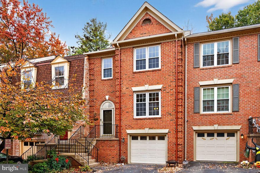 Welcome to this spacious 2,688 sq. ft. brick-front townhome with garage parking, ideally situated in the sought-after Willow Creek community. Perfectly located just a half mile from the Van Dorn Metro and I-495, this home offers exceptional convenience to the best of Alexandria and the DC Metro area.

Step inside to an open and airy floor plan featuring sweeping hardwood floors, a formal living and dining room, and a bright eat-in kitchen with a breakfast area and access to a private deck—perfect for morning coffee or evening entertaining. Upstairs, the generous Owner’s Suite impresses with vaulted ceilings, a skylight, and a large ensuite bath. Two additional bedrooms and a full bath are tucked privately down the hall, providing comfort and flexibility for guests or a home office. The walk-out lower level offers a spacious recreation room with a cozy wood-burning fireplace, a half bath, laundry room, storage space, and access to the oversized one-car garage. Set in a highly convenient location close to major commuter routes, multiple town centers, Van Dorn Metro Station, and Fort Belvoir—this home truly has it all. Schedule your private tour today!
