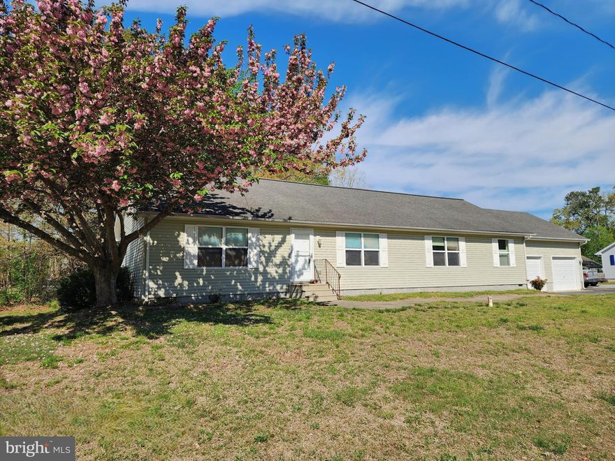 A rare find in this subdivision: Large 3BR, 2BA rancher with a 2-car garage situated on a manageable yard.  The development of "Sandy Beach" has access to the Indian River, offering kayak drops and a small boat ramp. Enjoy fishing, crabbing and jet skiing too!