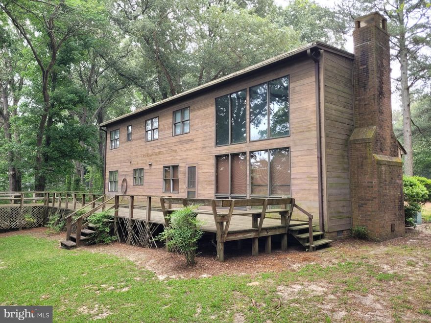 Recent Price Improvement Alert!! WATERFRONT!  This custom-built, 4 Bedroom, 2 Bath Home with attached garage is situated on 1.88 acres of high ground fronting on the beautiful Pocomoke River. Home features 1st Floor Master Bedroom and Bath,  large family room/dining room with vaulted ceilings and large bay windows,  kitchen with eat-in area, craftsman doors, cabinets and woodwork throughout.  Andersen Windows. Large walk-in closets.  Enjoy the scenery and views from the very large 54'x 12' + 39'x 10' back deck and enjoy boating and swimming from your very own dock on the river. This is truly a one-of-a kind home with lots of potential to make your own!