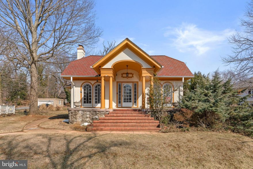 Defined by a gatepost-framed brick walkway leading to the wide front porch, dramatic arched picture windows and entry door, and classical columns with detailed moldings, 513 Stamford Road offers iconic curb appeal and exceptional reno potential in one of Baltimore’s most distinctive historic communities. Built in 1925 and located in the CHAP-designated Historic Ten Hills district - known for its winding streets, storybook architecture, and proximity to Catonsville - this home presents a rare opportunity within a notable neighborhood. Buyers are encouraged to explore potential CHAP renovation tax credits. Inside, original inlaid hardwood floors span the living and dining rooms, and the brick wood-burning fireplace with mantle adds timeless character. Just off the dining room, the light-filled octagonal study provides architectural interest and flexible living space. The oversized kitchen includes a breakfast nook and walk-in pantry, with access to the rear deck. The upper level offers generous flex spaces with potential for additional bedrooms or the creation of a spacious primary suite with room to add a primary bath. The lower level features a finished recreation room, potential fourth bedroom, full bath, laundry area, three large storage rooms, and a walkout to the peacefully serene rear yard. Ample parking includes a 4+ car driveway and a detached two-car garage with attic storage. This renovation project is your chance to restore and personalize one of Ten Hills’ signature homes to honor its historic appeal, while adding enduring value. Agents please review agent remarks and disclosures with your buyers.
