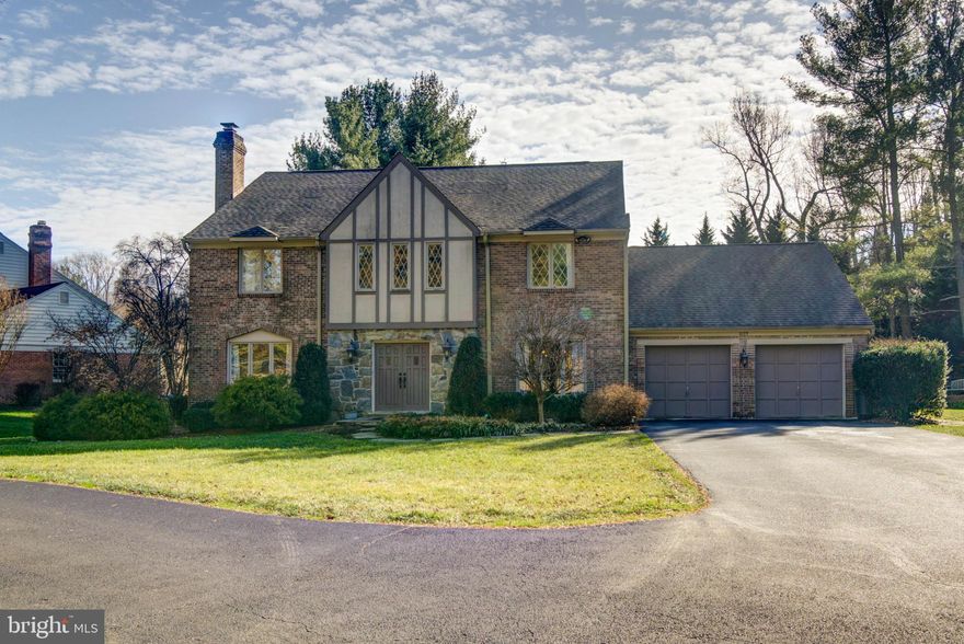 Located in highly desirable Cedars of McLean, a stunning subdivision on a private road. This gorgeous over 5,000 square foot, four-sided brick Tudor is situated perfectly on an over half acre lot. Offering you privacy with its updated lush landscaping and convenience with its easy access to Tysons Corner, Dulles Toll Road, and the Capital Beltway. It is also steps away from acres of parkland, with trails along streams and bridges for a short walk to Spring Hill recreation Center. 

Upon entering this four- bedroom, three and a half bathroom, home you will be greeted by an open two-story foyer and gleaming hard wood floors which run on the main level and are carried throughout the entire second level. Just steps off the foyer is the formal dining room which offers beautiful custom wainscotting and boasts enough space to accompany seating for twelve. Flowing effortlessly into the gourmet kitchen you will find updated granite countertops, stainless steel appliances and a breakfast area. The free-flowing floorplan opens the gourmet kitchen to the family room. Which is complete with an all-stone propane fireplace, three double hung windows and glass French doors that provide picturesque views to the rear of the half acre lot. Abutting the family room is a large office with southern exposed windows and an adjoining formal family room with a wood burning fireplace. 

Ascending the grand staircase to the upper level you will find a spacious primary suite. Highlighted by a large sitting room with adjoining deck overlooking the rear yard, walk-in closet, large primary bathroom with a double granite countertop vanity, glass enclosed shower and jacuzzi tub. Off the hall you will find three spacious additional bedrooms each with ample closet space and tons of natural light. The upper-level hall bathroom has been updated to include newer tile floors and granite. 

The lower level showcases nine-foot ceilings creating a wealth of volume an open layout, full bathroom, bonus room and a utility room with abundant storage space.