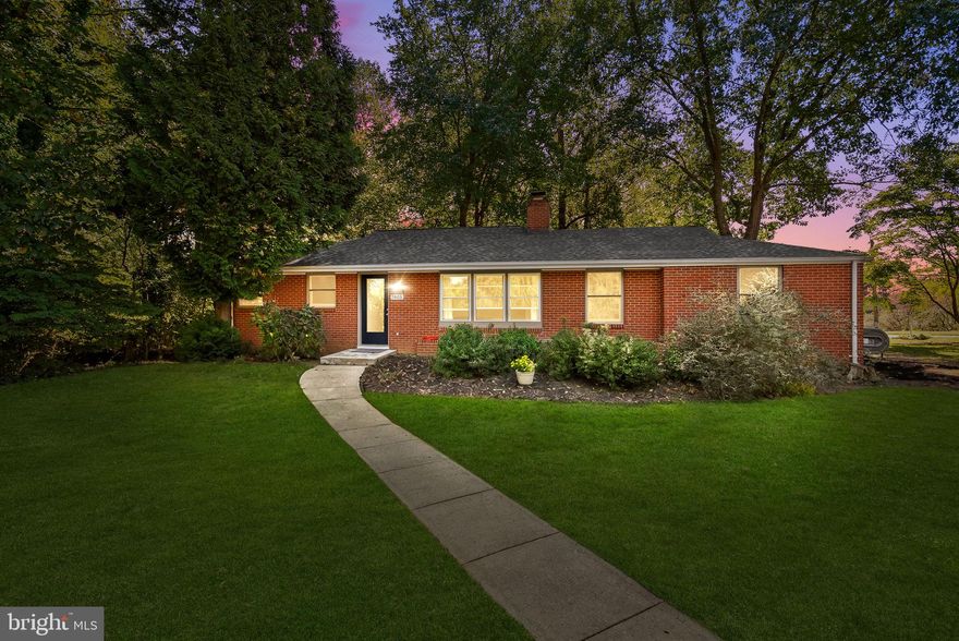 Located in the highly sought-after River Hill High School district, this charming brick-front home is set on a spacious and private 1.09-acre corner lot. A long private driveway and rear-entry garage create a welcoming sense of arrival, while the expansive yard surrounded by mature trees in a neighborhood setting offers peace, privacy, and room to enjoy the outdoors.

Inside, gleaming hardwood floors flow throughout the main living areas. The inviting living room features a beautiful two-sided brick fireplace that also enhances the dining room ambiance, creating warmth and character in both spaces. The dining area leads seamlessly into the updated bright kitchen, complete with stainless steel appliances, quartz countertops, a coffee bar, and serene views of the upgraded deck and private backyard framed by nature.

The main level offers three bedrooms and one a half baths. The primary suite includes a full ensuite bathroom, while the two additional bedrooms each feature ceiling fans, with one offering the added benefit of two closets.

The recently renovated lower level provides exceptional additional living space. Enjoy an expansive recreation room with a fireplace and recessed lighting, plus a separate sitting area or playroom with windows and outside access. A bonus room with closet and ceiling fan offers flexibility as a potential fourth bedroom, office, or guest space. The lower level also features a beautifully updated full bathroom with modern finishes and a striking glass shower, along with an oversized laundry and storage area that adds everyday convenience.

Recent updates include a brand-new well (2025), a whole-house water filtration system (2024), and a newer roof (2023), offering peace of mind and modern functionality throughout.

This home offers the ideal combination of privacy, thoughtful updates, and a prime location in one of the area’s most desirable neighborhoods and school districts. Conveniently located near Johns Hopkins APL, BWI Airport, Fort Meade, and major commuter routes, this home is steps from Maple Lawn shops, dining, and everyday amenities. Enjoy parks, trails, seasonal festivals, farmers’ markets, and year-round community events in Clarksville.