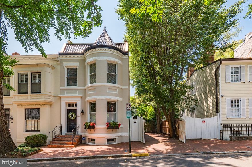 Beautiful brick 3Br 2ba home with lovely cupola  and large carriage house attached by enclosed breezeway in the rear opening to beautiful courtyard garden. Combined space 4200 sf. Carriage house has large family room and kitchenette and powder room on main level and a bedroom, bath, plus  office upstairs.   Home and carriage house were completely renovated by Tom Glass in 2015 and current homeowners have done additional improvements including but not limited to new patio, new roof on carriage house, and all new windows in front and French doors on the side - which open to 2 car gated tandem  parking.  Main house has lovely open floorplan on first floor with one gas fireplace and 2 wood burning ones. This is a jewel of a property!