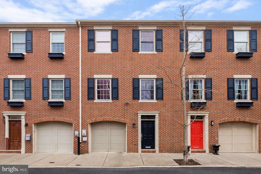 Incredible value on a quiet Northern Liberties block—this 20’ wide, 2,200 SF home with garage parking offers 3 bedrooms, 2.5 baths, and multiple outdoor spaces with no HOA or condo fees.  Enter through a spacious foyer with coat closet, garage access, powder room, and a versatile flex space ideal for a den, media room, office, or gym. Sliding doors lead to a private brick patio, perfect for entertaining.  The extra-wide second level is the highlight of the home, featuring high ceilings, wide-plank hardwood floors, and generous living and dining areas. The rear kitchen includes white cabinetry, quartz countertops, stainless steel appliances, and an island with seating and storage. Just off the kitchen is a casual dining area with pantry and access to a rear balcony. A full dining space and expansive front living room provide ample room for both everyday living and hosting.  Upstairs, the rear primary suite features double closets, a private bath with double vanity and stall shower, plus its own balcony. Two front bedrooms with large closets share a hall bath with tub and oversized vanity. A wide laundry closet completes the level.  The extra width extends to the garage, comfortably fitting your largest SUV with room to fully open doors, plus additional storage.  Prime Northern Liberties location with easy access to Fishtown hotspots, Center City, public transit, I-95, and the NJ bridges. A rare opportunity to own an extra-wide home with garage parking—without the added cost of HOA or condo fees. Will not last, schedule your showing today!