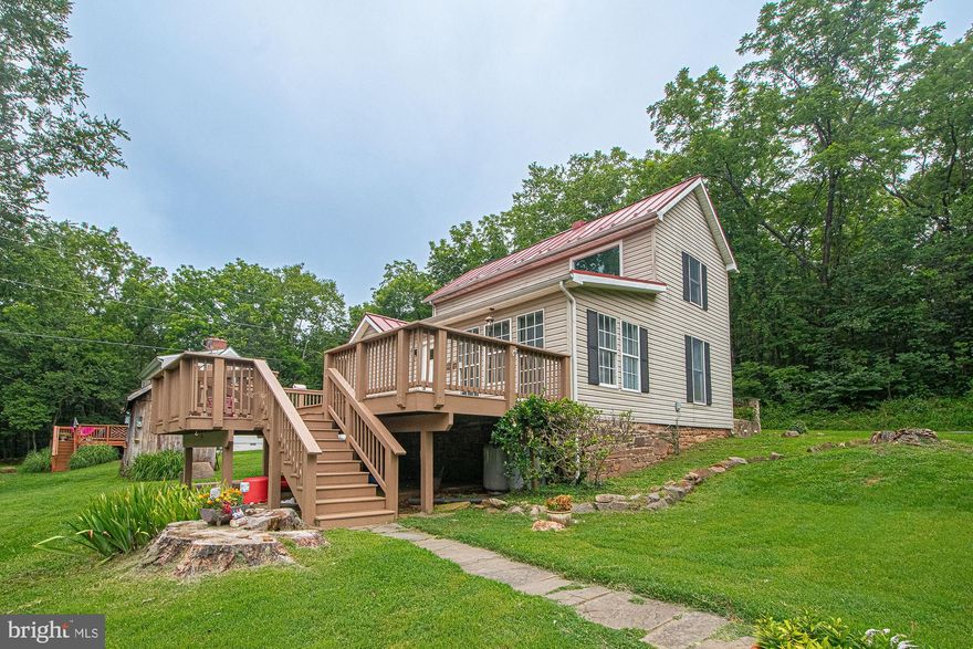 Waterfront and Within minutes to Old Town Warrenton!  This Well Maintained Hand-Built Federal sits upon a Modest Hill overlooking the Historic Auburn Village and Bridge, Cedar Run Creek and  Neavil's Mill.  The lush landscaped grounds and surroundings give an alluring storybook feel loaded with Southern Charm.  The foundation is hand built solid fieldstone and through all various storms has reportedly remained dry.  The roof is metal so you can enjoy the tranquil sounds of delightful spring rains.  The interior of the home has two Cathedral ceilings, one in the kitchen on the main level and the other is in a large upper bedroom.  The living room displays hand hewn Post and Beams carved from a local mill, undoubtedly Neavil's Mill.   The kitchen cabinets are uniquely handmade and framed perfectly.  There are three bedrooms, one on the main level and two upstairs as well.  One of which has an exposed brick chimney and an upper roomy loft.   Washer and dryer are located on the upper level.  All walls newly painted and new bath floorings.  Plenty of parking spaces.  No need for a home inspection, Seller has done it for you prior to list.  This home indeed stands the test of time!  They don't make them like they used to.   Come See It and Check All the Boxes!