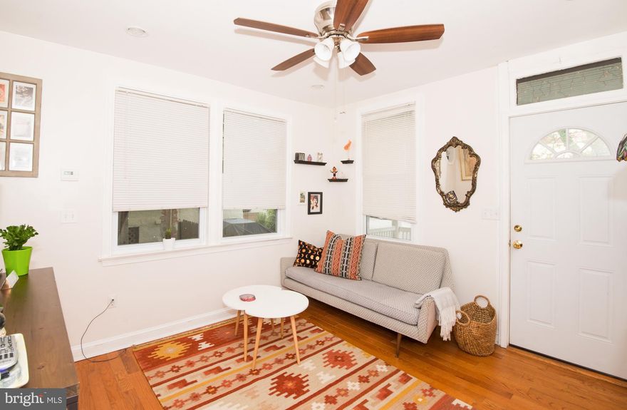 Desirable Two Bedroom porch front - End of Row home in Hampden Hon. Steps away from the Rotunda, The Avenue, and many other up and coming establishments. This Elm Ave. home features a large eat-in kitchen, PRIVATE PARKING PAD, 200 Amp Electric, large backyard with shed that has electric, and Recessed lighting and fans throughout.