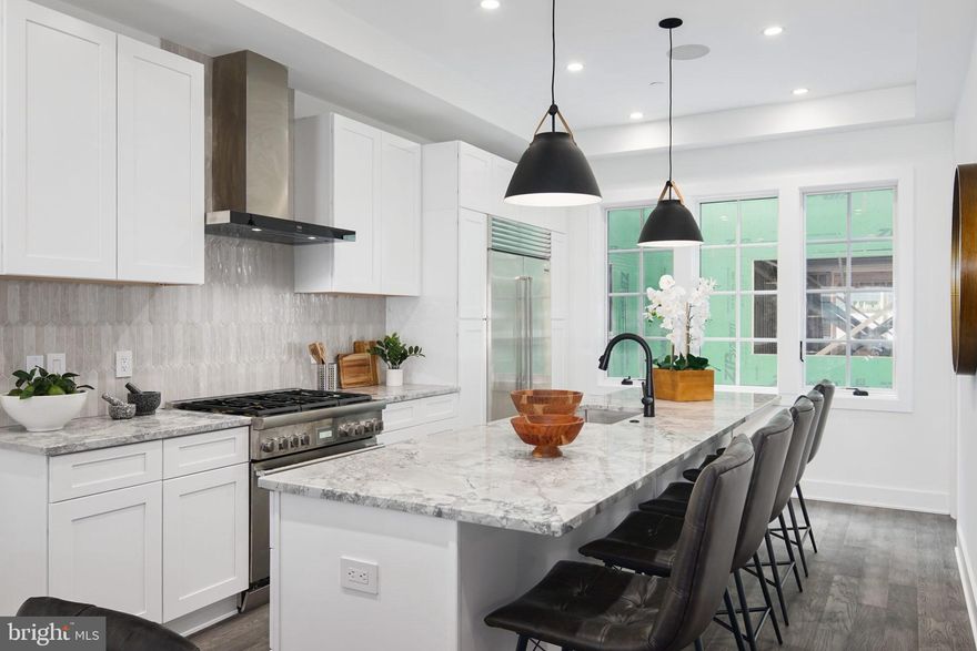 2- CAR PARKING IS OFFERED & NEW FINISHES AVAILABLE! Luxury Living at Lydian Place offers the quintessential city lifestyle. These ten exquisitely designed townhomes on the Avenue of the Arts create a unique urban experience to enjoy the rich cultural life of Center City Philadelphia.  With over 4,000 square feet of living space across 5 levels, each home features 4 spacious bedrooms, 4 full baths, and 2 half bathrooms, with a masterfully designed pilothouse, 2 decks, and a personal elevator! Step up from the light-filled foyer and atrium to the expansive open concept main level. Enjoy the comfortable living room with high ceilings, modern flooring throughout, and an ample dining area that flows into the gourmet chef kitchen. Luxurious yet functional, the kitchen features custom quartz countertops, and backsplash, with appliances from Subzero, Thermador, Bosch, and Wolf. The third floor is comprised of two large bedrooms with en-suite bathrooms, walk-in closets, and a full-sized laundry room. The impressive owner's bedroom is a regal 600 sq. ft and is the ultimate sanctuary occupying the entire fourth floor. The primary bathroom features a freestanding soaking tub, an oversized shower room of seamless glass, a private lavatory, and double vanity. Special attention has been given to the rooftop with a masterfully designed layout highlighting a spacious 375 sq. ft pilothouse complete with a custom wet bar and convenient powder room nestled between the two separate decks. This optimal space for entertaining offers spectacular panoramic views of the Philadelphia skyline. More home enjoyment comes with the fully finished lower-level family room or media room and includes a bedroom/office/exercise room and full bathroom. Each home offers garage parking with tons of extra room for storage, a top-of-the-line security system with one year of free monitoring services, and a multi-zoned energy-efficient HVAC system. The audio system includes five pairs of in-ceiling speakers, one pair of outdoor speakers.  Smart wiring infrastructure is installed for ultimate convenience and future upgrade possibilities with dual data (Cat6) and cable in every bedroom. Walk Score - 97 Transit Score - 100 Bike Score - 88. Conveniently located near Target, Sprouts Market, Whole Foods, Pet Smart, & PA Wine & Spirit Shop. Some homes are currently being built. Taxes estimated, 10 YEAR TAX ABATEMENT, some finish choices may vary, some features shown may vary slightly, Specifications, details, and finishes are subject to change. *PHOTOS OF MODEL UNIT 744 BROAD*