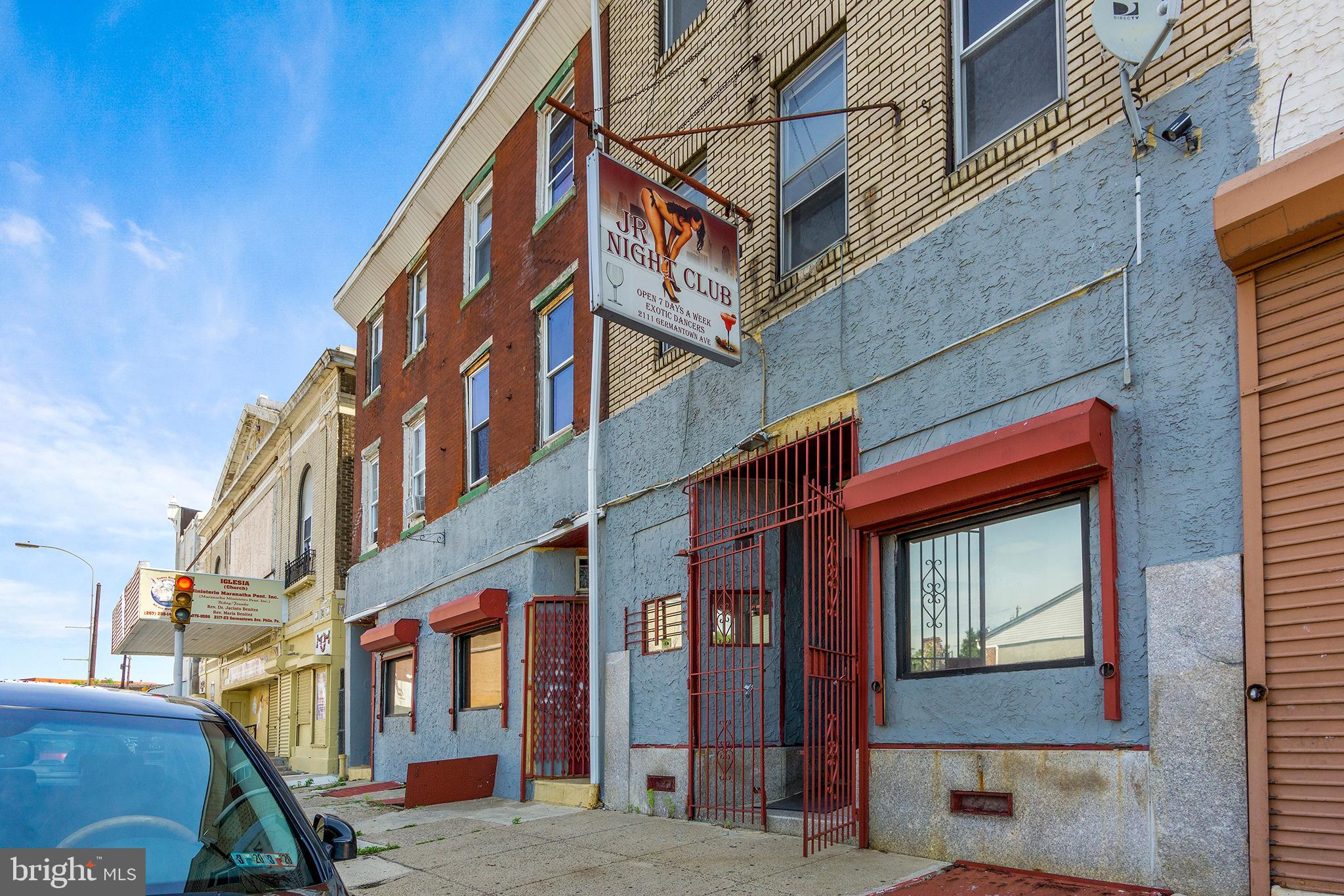 INCREDIBLE INVESTMENT OPPORTUNITY IN BOOMING OLD KENSINGTON! Nearly 10,000 square feet across two adjoining properties (2111, 2113-2115 Germantown Ave), all zoned CMX2 and brimming with redevelopment potential. This portfolio is being sold in as-is condition and presents a rare chance to own a substantial footprint in one of Philadelphia’s most rapidly transforming neighborhoods.
The first floors currently feature spacious commercial areas, formerly home to a restaurant, lounge, and full bar. With an open layout, high ceilings, and plenty of square footage to work with, these spaces are primed for a reimagining—whether as a hospitality venue, retail concept, or creative mixed-use hub. The seller prefers to sell with the liquor license, adding immediate value and flexibility, but is open to selling without it.
Above the commercial level, the 2nd and 3rd floors are configured as apartment units, providing a fantastic foundation for rental income or full-scale redevelopment into modern residential spaces. With two properties included in the sale, investors have endless opportunities—convert into multiple income-producing units, create a mixed-use development, or hold as part of a long-term investment strategy in a thriving market. Located just blocks from Temple University and surrounded by major new development, this location offers high visibility, strong foot traffic, and proximity to public transportation. Old Kensington has quickly become one of the city’s most desirable areas, blending historic charm with cutting-edge growth—making this a prime time to invest. Don’t miss this chance to secure a substantial property package with limitless upside in one of Philadelphia’s hottest neighborhoods!