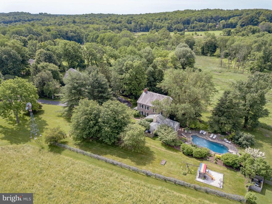 Visit https://bit.ly/2146California3D for a 3D walkthrough, and https://www.seetheproperty.com/u/316740 for photos, floorplans and more! One of the best properties on the market, Cooks Creek Farm is one of the jewels of Bucks County.  Historically, these stone manor houses were built with southern exposure to capture the light, positioned on the high point of their acreage to overlook their fields and pastures, and with long driveways leading past bank barns and farm buildings. Such bucolic settings are rare now, but amongst them, this gracious gentleman's farm stands out as an example of the very best. The approach, down a half mile long drive, across a bridge over Cooks Creek, brings one to the center of a 34 acre Bucks County estate. The imposing stone manor house, with lovely vistas from every window, is in impeccable order.  Quintessential  is the best adjective to accompany every description of this circa 1751 farm, part of an original William Penn grant. Whether it is privacy, beauty, architecture or history that you desire, Cooks Creek Farm will not disappoint. Both inside and out, an 18th century character and timeless dignity are evident. Enhanced with upscale appointments, this historic home welcomes and envelops with warmth and grace. The foyer and living room, both with Moravian fireplaces, are testament to the home's pre-revolutionary heritage. A stunning kitchen renovation showcases honed marble, custom cabinetry and top-of-the- line appliances. The family room, living room, sunroom, kitchen and dining room all overlook meticulously landscaped acreage and meadows that have been allowed to return to their natural definition. The first floor layout invites elegant entertaining, and each room is richly-laden with exemplary woodwork. Throughout the house there are six fireplaces. On the second floor, there is a master suite with fireplace, and a luxurious new bathroom and spacious walk-in closet. Unusual for a home of this vintage, you can enjoy these soothing enhancements while luxuriating in the warmth that radiant-heated random width floors, deep window sills, and plaster walls can impart. Two additional bedrooms and a fabulous new bath complete the second floor. The third floor bedroom/bonus room is vaulted to embellish the space, and will be a room that family and guests request every time. With the home's generator, you can relax and invite a crowd for every holiday. Outside areas for intimate or formal gatherings abound. Patios and pool area with rock walls are nestled on the southerly and westerly sides of the home, creating a place at day's end for family and friends to gather. Weddings and other special occasions have always graced this area with memories that befit and embellish the history of Cooks Creek Farm. In keeping with the role of a bespoke Bucks County Estate, there is a charming guest cottage and a renovated Pennsylvania bank barn, offering garaging for four cars, and a party room above enhanced with two convenient bathrooms. Although PA barns are a disappearing item on our landscape, those that have been maintained and enhanced are truly a rare find. Adding to the farm's allure is a greenhouse that will let you explore your creative side.  At Cooks Creek Farm, every detail is presented artfully and joyfully, in a setting that provides seclusion in the summer and beautiful valley views in winter. This private paradise loses touch with the world just over the hills and yet remains within 15 minutes to Routes 309, I-78, and the Northeast extension of the PA turnpike. Relax and let the days settle in around you. Visit https://bit.ly/2LKJxhu to view the video and accompanying write-up by WFMZ.