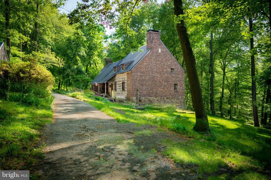 Located in one of Chester County's most desirable valleys and positioned beside the South Branch of the French Creek, this charming and secluded home is situated on over 20 acres.  Iron Bridge Farm is a beautifully restored historic log home, nestled in a picturesque spot at the end of a long private lane.Exposed wooden beams, hemlock floors, a walk-in fireplace, and an abundance of natural southern exposed light can be found through-out the first floor.  The kitchen has generous cabinet space and a large window overlooking the creek.  There is a porch off the kitchen with a spacious deck perfect for al fresco dining and entertaining, offering spectacular views of the meadow, stream and creek.  The first floor master bedroom has a sitting area and separate dressing room.  The second floor has two bedrooms, each with a dressing room, and a connecting bathroom.  The property features a pool with cabana and patio.Across from the main house is a two story barn with a first floor studio and a generous second floor.  Continue down the lane, crossing the idyllic stream, and find a 4-car carriage building.  A fully functioning barn perfect for goats, sheep, llamas or alpacas, contains a milking room, 6 stalls and a cheese kitchen.  Iron Bridge Farm produced some of the finest, national award winning Chester County goat cheese.Iron Bridge Farm offers a quaint tenant home, perfect for a caretaker, second residence, or rental.  It features 1 bedroom, 1 bathroom, a walk-in closet, an open living room with apothecary window, and a cozy kitchen.  The covered porch faces the French Creek.  Iron Bridge Farm has been impeccably maintained and appeals to the discerning country buyer.  Welcome Home!