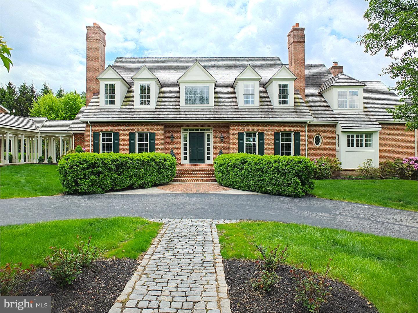A classic all brick Williamsburg colonial, in the prestigious Four Oaks area of Charlestown Township. Situated on four manicured acres with sweeping views, this pristine home affords an excellent backdrop for garden parties or fireside gatherings. The soaring two story center hall entrance, with marble floor, sets the stage for the grand staircase as your eyes follows the light from the floor to ceiling windows. The open floor plan allows those in the kitchen to converse with those in the atrium and the family room. The first floor master bedroom, with tray ceiling and marble fireplace, has access to the expansive terraces overlooking the lush vistas. The master bath has a marble floor, Jacuzzi, bidet, large stall shower and fabulous fitted closet. An all white kitchen, featuring all new appliances and custom Gobel cabinetry with glass display doors, flows into the two story atrium with Palladian-topped window wall. The two story family room is highlighted by a dramatic California fireplace with raised granite hearth. The second floor will not disappoint. An extensive interior balcony is accessible from the 4 bedrooms and two baths, and benefits from the abundant sunlight that pours in from the Atrium. The basement has a finished office. The huge lower level, with veranda door to patio, awaits your finishing touch. The two garages are attached to the house by a colonnade, second to none. The three car garage has storage above. But the piece de resistance is the 10 car bank garage that will make the most particular car collector weep with desire. This 2700 Sq. Ft. garage has been built to commercial parking lot specifications of 50 Lbs./Sq. ft., the second floor overhead door 11 x 8 for vehicle access. And for the horse owner or lover, this home is surrounded by hacking trails and horse farms . There is so much more, contact the listing agent for the list.