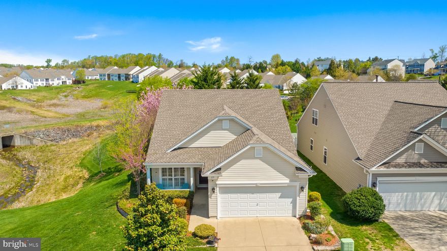 This gorgeous home is picture perfect inside and out! Coming soon to Falls Run!
Enjoy all your seasons here in this pleasantly situated home with all the attractiveness of one level living surrounded by nature and scenery. The home sits next to open community space and has been lovinlgy manicured for 4 season enjoyment. Heated and cooled sunroom on the back of the house netsled in flowing trees and perennials is the retreat you'll enjoy endlessly. You'll love the additional back deck for grilling or gardening and frequent bird watching too! 
Welcoming entrance with a two seater front porch, easy front entrance, and warm hardwoods throughout the main living space. Plantation shutters on the windows adding charm and privacy without losing the view of the green (or orange or white!) in all the seasons. Open concept living and dining area complete with a cozy fireplace and entertainment set up, modern lighting, and a passthrough to your lovely kitchen. Kitchen has been appointed with updated appliances, granite counters, and a new built in dining nook with storage that the owner is happy to leave for the new owner's enjoyment. Primary bedroom is spacious and has an expansive walk-in closet with great attached bathroom. Additional spacious bedroom with charming floating bookshelves and separate full bath. 
The community offers activities, engagement, recreation, and fitness with the indoor and outdoor pool, workout equipment in community gym, sidewalks and trails to enjoy, and opportunities to involve yourself in many activities. The community planner has games, trips, activities, groups, and more ready for you to engage in. 
Welcome to Falls Run and 119 Smithfield Way!