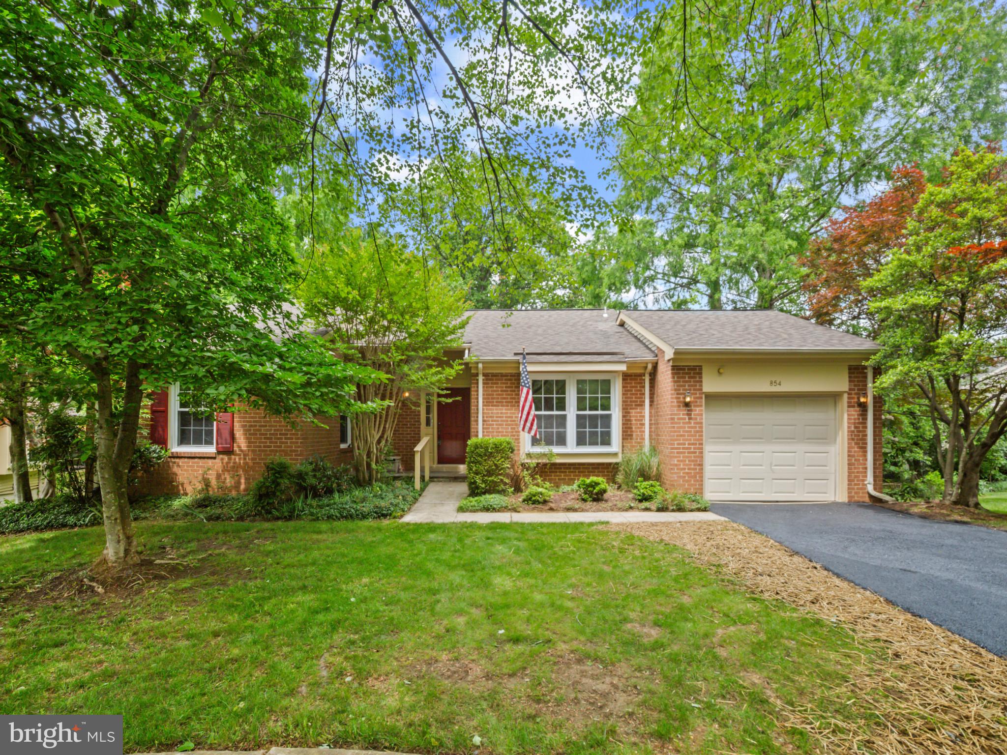 This Golfers Ridge single-family home in Heritage Harbour is located on a friendly cul-de-sac and backs to peaceful and private woods. Easy access from the garage to the kitchen or from the front door into the foyer. Lovely warm original parquet floors flow throughout. The kitchen has a user-friendly peninsula and extra glass-front cabinets for plentiful storage. The kitchen is bright and sunny with south-facing windows and a side window facing the front entry. Large and open living and dining areas provide space for entertaining friends or family for holiday dinners or casual gatherings. The cozy east-facing sitting/tv room has access to the corner deck via sliding doors. Each living area offers woods-facing privacy and distance from neighbors. The corner deck offers the ideal space for summer dining or just enjoying the birds and the sounds of summer. The main floor laundry offers the convenience of easy access from both bedrooms. The primary bedroom has an ensuite bath with double sinks and a walk-in shower, and has a large walk-in closet. The guest bedroom has a full closet for additional storage, and hallway access to a second full bath with a tub/shower combination. Now for the bonus! A bright open stairwell with a large window and a landing is carpeted, and offers easy access to a huge basement that runs the full length of the home. The basement glass slider provides outdoor access and tons of light. Perfect for a third bedroom for guests or an entertainment space for the "grands." The lower level features a half-bath, large walk-in closet, and a separate room for additional storage space, an office, or a media room. If you are down-sizing, this is an elegant storage solution for all those cherished items that you are not ready to part with! Neighborhood amenities include indoor & outdoor pools, tennis & pickleball courts, 9-hole, par-3 executive golf course, on-site restaurant, theater room, a billiard room, woodshop, library, and more. Clubs and activities include Zumba, movie nights, dinner club, mahjong, dancing, bocce ball, horseshoes, kayaking, biking, remote-control sailing, and more. This is the ideal solution for downsizing...quiet single-family, one-level living in a sought-after Heritage Harbour location...with tons of storage!