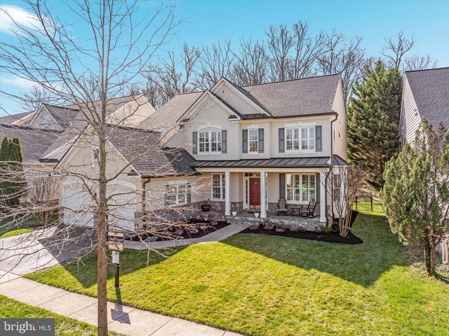 Welcome to this beautifully updated 5-bedroom, 4 full bath home in the highly sought-after Lansdowne on the Potomac community, offering a perfect blend of modern luxury, functional living space, and a serene natural setting. This move-in-ready residence features a spacious and versatile layout with a main-level bedroom and full bath, four bedrooms upstairs, and a fully finished lower level complete with a large recreation room, kitchenette, full bath, and multiple flexible-use spaces ideal for a home office, gym, or guest accommodations. The home has been extensively upgraded with new hardwood flooring on the main and upper levels, luxury vinyl plank flooring in the basement, fresh paint, plantation shutters throughout, and a fully renovated gourmet kitchen (2020) featuring a Wolf 6-burner gas range with double oven, Sub-Zero refrigerator and freezer, custom cabinetry to the ceiling, expanded counter space with seating, premium beverage and wine coolers, and high-end finishes throughout. Additional improvements include renovated bathrooms, a redesigned laundry room with granite countertops and custom cabinetry, updated gas fireplace with reclaimed wood mantle, new roof, upgraded HVAC systems, new water heater, and insulated garage doors with updated motors. The exterior offers a charming front porch, fenced backyard, irrigation system, landscape lighting, and a private, picturesque lot backing to nature—providing both tranquility and everyday comfort. Lansdowne on the Potomac provides exceptional resort-style amenities, including a year-round heated indoor lap pool, multiple outdoor pools with beach-entry and water features, tennis and pickleball courts, sand volleyball, scenic walking trails, and newly renovated playgrounds, along with a state-of-the-art 3,600 sq ft fitness center and a beautifully updated clubhouse with meeting rooms, ballroom, business center, and game room.  Ideally located just minutes from Leesburg Premium Outlets, Wegmans, Whole Foods, Costco, One Loudoun, Dulles Town Center, Topgolf, and a wide variety of dining, shopping, and entertainment options, with easy access to Route 7, Route 28, the Metro, and Dulles International Airport.