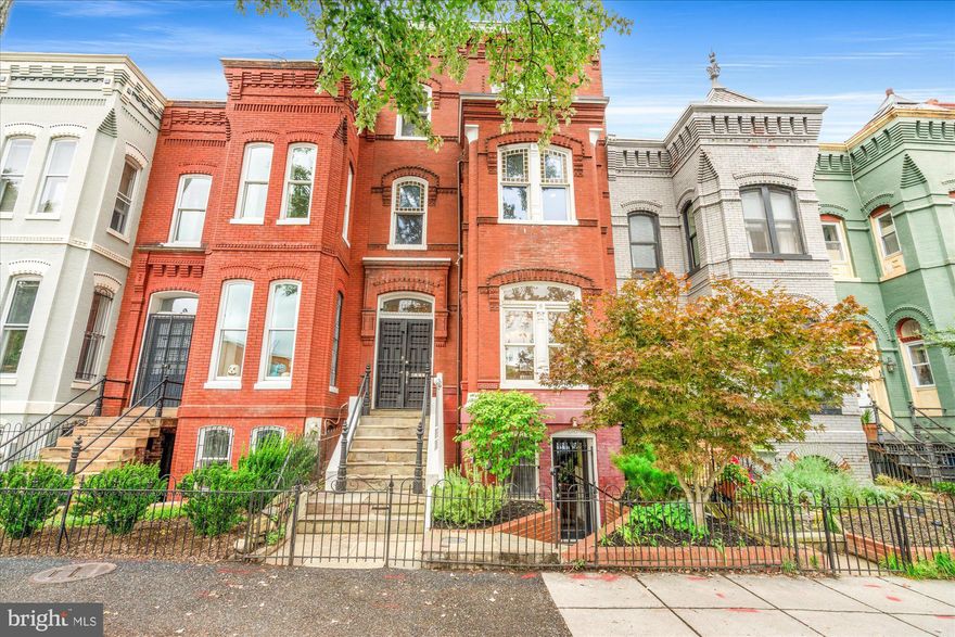 Welcome home to 1209 S St NW, a historic townhouse with four bedrooms, four and one-half baths with multiple roof decks and dedicated, secure off-street parking in the heart of DC. This home is overflowing with traditional details and boasts thoughtful updates and modern conveniences throughout. 

Step into the home via a formal entryway and be greeted by a grand staircase with the original bannister. Just off the foyer to the right is a spacious and abundantly bright formal living room with high ceilings featuring crown molding and a fireplace. The original pocket doors lead you to a large dining room with an additional fireplace. Just past the dining room is a bonus family room, that leads to a beautifully updated chef's kitchen with massive skylights that make the space extra bright and airy. The main level has direct access to the backyard that features a deck, flagstone patio and secure two-car off-street parking. The lower level includes a bonus family room and is highlighted by a custom wine cellar featuring original exposed brick. 

Ascend the staircase to the second level which features two light-filled bedroom suites. The primary suite includes a sitting area with a stunning original ornate fireplace and mantle. Custom built-ins and a walkthrough closet lead to the primary bath  which boasts dual vanity sinks, a steam shower and separate water closet. A laundry closet completes this level. The upper floor has the third bedroom suite and a bonus living area that is perfect for a home office, gym or den with two large closets for storage. From this level, step out to the jaw dropping two-story roof deck, with spectacular city views. 

The property also includes a separate one-bedroom, one-bath plus laundry suite on the lower level with its own front and rear entrances. A perfect in-law or au pair suite, this unit is an amazing bonus space, or alternatively is ready to be utilized as an income generator. 

This rarely available, full-size townhome with separate rental unit is located on the same block as neighborhood favorite The Coffee Bar and minutes away from all of the shops and restaurants of Logan Circle and 14th Street. First Open Houses Saturday and Sunday October 11 + 12 from 12 - 2 PM, this opportunity is not to be missed.