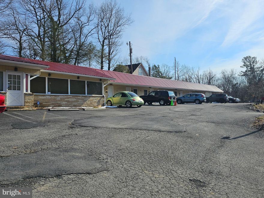 INVESTMENT PROPERTY PLUS RESIDENCE - This property has two rental buildings containing 11 small rental units and a 3-bedroom 2-bathroom residence.  These apartments are currently being rented long term but can become short term rental units if you choose. The main building also includes a laundry room. The two buildings currently generate $10,250.00 per month in rental income.  The two buildings have been completely renovated within the last two years to include a new roof on both buildings. The home had a new roof approximately 6 years ago. The 3-bedroom 2-bathroom home plus a loft is also a money-making investment. The home is currently being used as an Airbnb but can become your full-time residence. The house generates an average of $3,000.00 to $4,500.00 per month. This brings your total gross income revenue to $13,250.00-$14,500.00 per month. With a large living room & entertainment room combined there is plenty of space for the whole family. All this is within a couple 100 yards of the Cacapon State Park entrance. Walking distance to swimming, hiking, fishing, boating, horseback riding, skeet shooting and even golf. This is a residence with a turnkey business. Don't miss out.
Due to renters, 48- hour notice is required to visit property. All clients must submit a preapproval or proof of funds before any appointments will be confirmed.