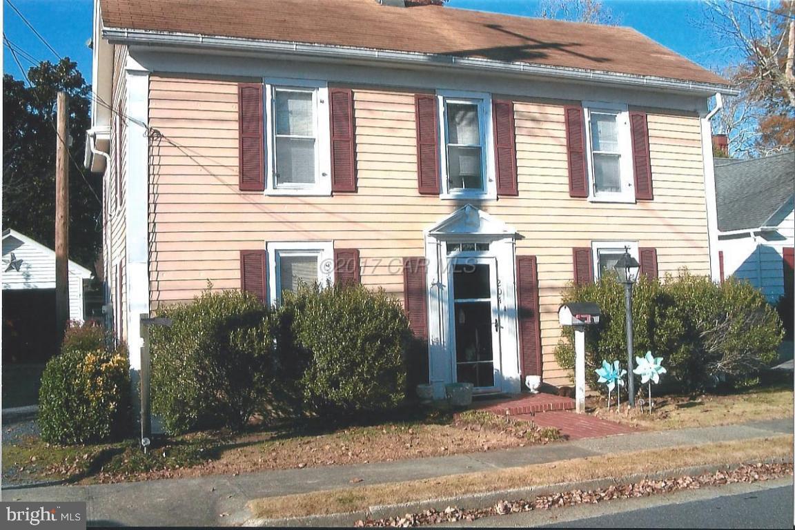 This attractive home has been well taken care of by the same owner for over 25 years. All rooms except the kitchen has hardwood floors under the carpet. Has detached garage with a work shop and electricity. Garage also has a new back door. Fenced in yard on high land. Has a new 55 gallon hot water heater, new exhaust fan in the half bath and central air. The den and 2 bedrooms have electric baseboard heat while the remainder of the house has forced air gas heat. The central air is in great working condition and has a yearly service contract with a local company.
