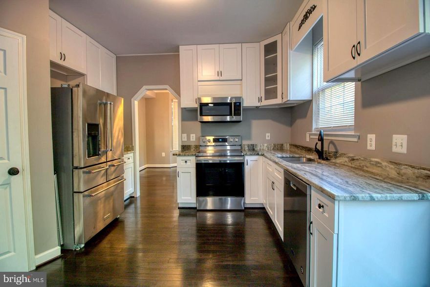 THIS SPARKLING RENOVATION IS MORE THAN MEETS THE EYE!  A MUST SEE WITH OVER 3500 SQ FT OF LIVING SPACE.  REMOLDED FROM TOP TO BOTTOM WITH HARDWOOD FLOORS THROUGHOUT, NEW CARPET, FRESH PAINT, GRANITE COUNTER TOPS,  STAINLESS STEEL APPLIANCES AND MORE. THE MASTER BEDROOM IS COMPLETE WITH TWO WALK-IN CLOSETS, SOAK IN TUB, AND SHOWER.  THE BASEMENT IS FULLY FINISHED WITH PLENTY OF ROOM FOR ENTERTAINMENT AND THE BACKYARD IS FULLY FENCED WITH A HUGE DECK, SHED AND PLAYGROUND. IF YOU'VE BEEN LOOKING FOR YOUR FOREVER HOME, LOOK NO FURTHER.