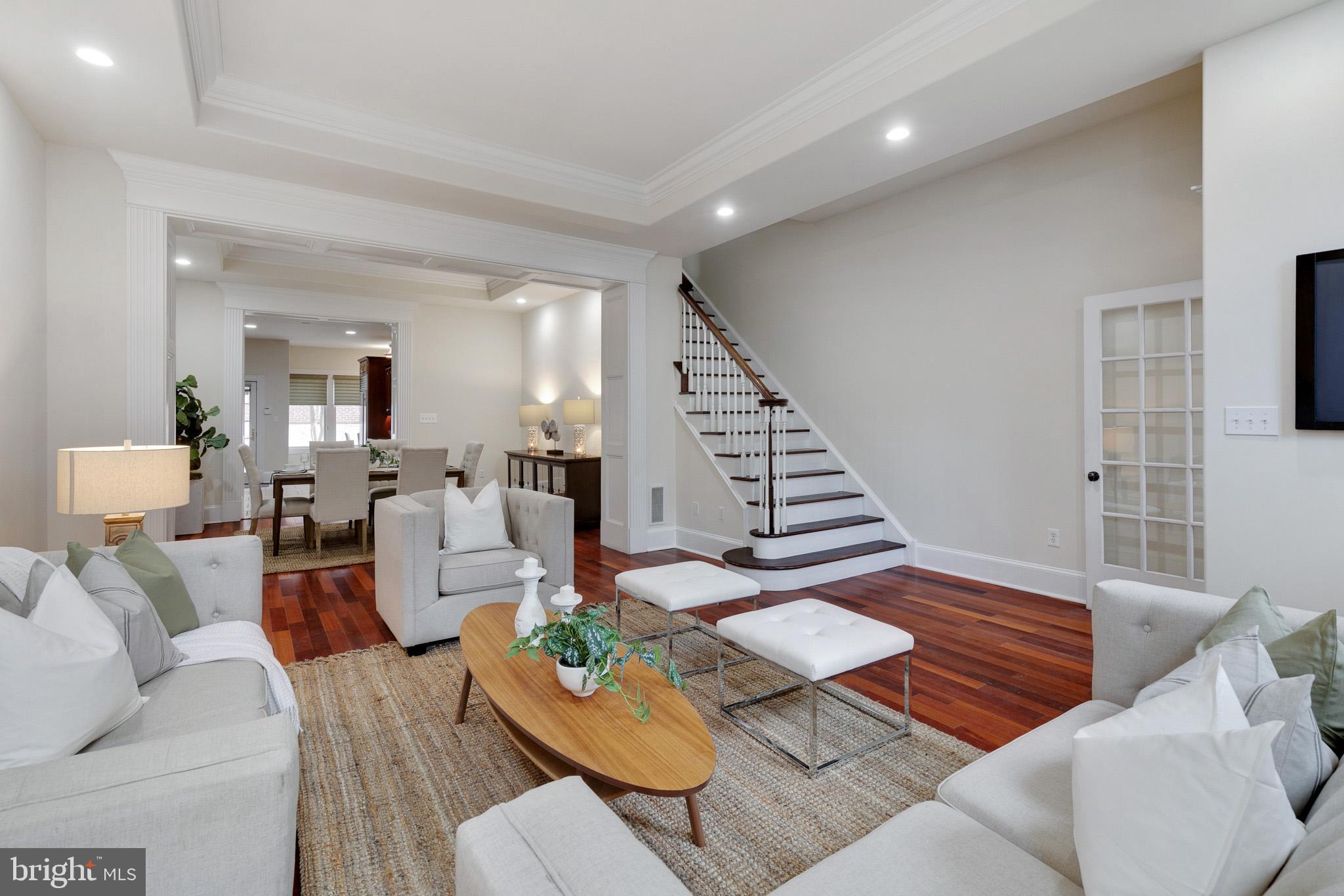 Stunning 5 bedroom, 2.5 bathroom traditional townhome in the prestigious Society Hill neighborhood of Philadelphia. No detail was spared in this massive colonial home boasting high-end finishes and Brazilian cherry hardwood floors throughout. Enter into the vestibule with beautiful black and white tiled floors, which leads into the large and open living and dining space. Amazing natural light beams through the home from the large windows. The spacious chef's kitchen exhibits a Miele dishwasher, Dacor microwave and double oven, SubZero refrigerator, Grohe and Kohler fixtures, a 6-burner cooktop, wine refrigerator, and wood cabinets. Right off of the kitchen is a breakfast area, which opens up to a lovely private courtyard. Powder room and in-unit washer and dryer are conveniently located right off the breakfast area. The huge primary suite occupies the whole second floor with a sitting area, private deck, two walk-in closets, and a luxurious full bathroom with two separate vanities, jacuzzi tub, glass shower with multiple shower heads, and linen closet. The third floor of the home has three large bedrooms and a full bathroom with a double vanity and a linen closet. The fourth floor is a great open flex space which can be used as a fifth bedroom, loft, or a library. There is also a fully finished basement, perfect for an extra den or living space. Located in the highly coveted Society Hill neighborhood steps from historic landmarks, museums, and plenty of dining options.