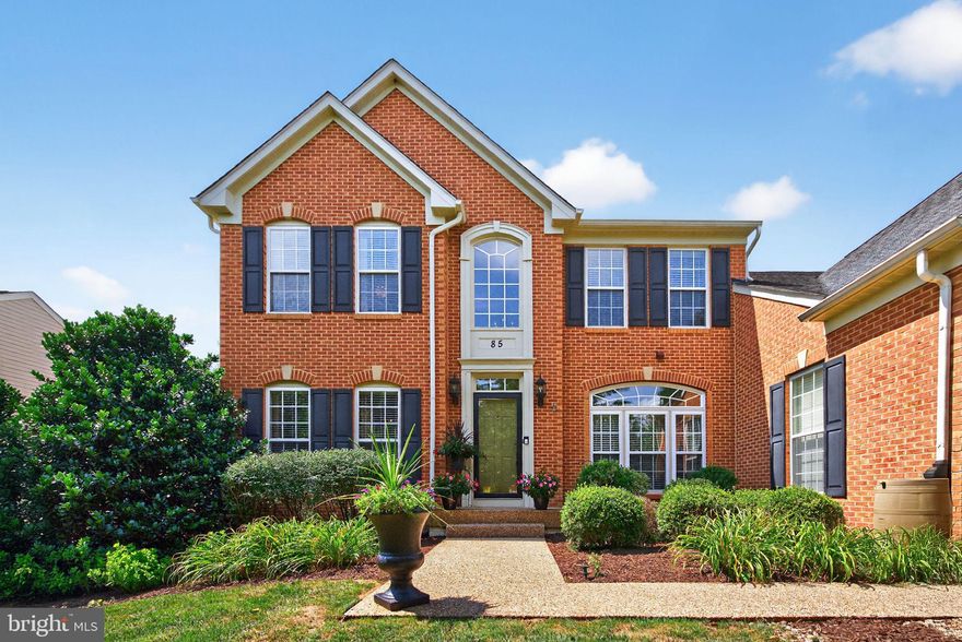 Located in the established Maddex Farm subdivision in Shepherdstown, this thoughtfully renovated 4-bedroom, 3.5-bath colonial offers spacious living and quality upgrades just minutes from town. With a main-level primary suite, finished walkout basement, and beautifully landscaped fenced yard, this home is designed for both comfort and functionality.

Inside, hardwood floors flow throughout the main and upper levels, complemented by new ceramic tile in the kitchen, dining, and bathroom areas. The kitchen features granite countertops, a flat cooktop, and double ovens—ideal for everyday cooking or entertaining. A vaulted ceiling and stone fireplace add warmth and character to the main living space.

The main-level primary suite includes two walk-in closets and a large attached bath with granite-topped vanities, a soaking tub, and separate walk-in shower. Upstairs, you'll find three additional bedrooms and an updated full bath.

Downstairs, the finished basement offers flexible space for work, play, or guests. It includes a home office with French doors, recessed lighting, and a ceiling fan, plus a spacious recreation area with Pergo flooring and a brick accent wall. A full bath, walkout access to the backyard, and a large storage area with a Culligan water system complete the lower level.

Step outside to enjoy a generously sized Trex deck with two Sunsetter awnings, extensive landscaping with stone retaining walls, and a fenced backyard with a built-in watering system. A two-car garage and paved driveway offer plenty of parking.

Enjoy the community feel of Maddex Farm with easy access to the walking path into Shepherdstown and optional membership to the Shepherd University Wellness Center available to Shepherdstown residents. Recent updates include new HVAC in 2021, new whole house water filtration system and water softener as of 2024, and full renovations to all bathrooms and the main living spaces.